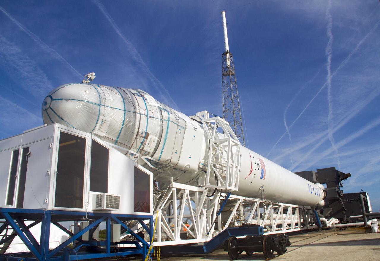 CAPE CANAVERAL, Fla. – The Falcon 9 rocket and its Dragon capsule are lowered onto a transporter on Space Launch Complex-40 on Cape Canaveral Air Force Station in Florida. The rocket is being returned to the protection of its hangar following a wet dress rehearsal on the pad March 1, which included loading the rocket with its propellants and a simulated countdown. The new rocket and capsule were designed and manufactured by Space Exploration Technologies Corp., or SpaceX, for the company’s upcoming demonstration test flight for NASA’s Commercial Orbital Transportation Services, or COTS, program. Under COTS, NASA has partnered with two private companies to develop the capability to deliver cargo to the International Space Station. During the flight, SpaceX's Dragon capsule will conduct a series of checkout procedures that will test and prove its systems. These tests include rendezvous and berthing with the space station and are intended to lead to regular resupply missions to the station. Liftoff is targeted for April 30 at 12:22 p.m. EDT pending official approval at the Flight Readiness Review on April 16. For more information, visit www.nasa.gov/exploration/commercial/cargo/spacex_index.html. Photo credit: NASA/Cory Huston