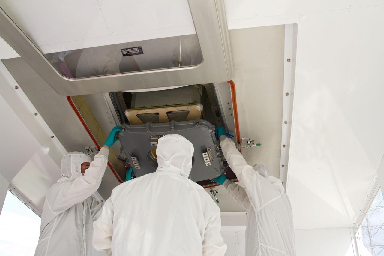 CAPE CANAVERAL, Fla. – In a processing facility at Space Launch Complex-40 on Cape Canaveral Air Force Station in Florida, a cargo container is installed inside a Dragon capsule. The Dragon is set to launch aboard a Falcon 9 rocket. The new rocket and capsule were designed and manufactured by Space Exploration Technologies Corp., or SpaceX, for the company’s upcoming demonstration test flight for NASA’s Commercial Orbital Transportation Services, or COTS, program. Under COTS, NASA has partnered with two private companies to develop the capability to deliver cargo to the International Space Station. During the flight, SpaceX's Dragon capsule will conduct a series of checkout procedures that will test and prove its systems. These tests include rendezvous and berthing with the space station and are intended to lead to regular resupply missions to the station. Liftoff is targeted for April 30 at 12:22 p.m. EDT pending official approval at the Flight Readiness Review on April 16. For more information, visit www.nasa.gov/exploration/commercial/cargo/spacex_index.html. Photo credit: NASA/Cory Huston