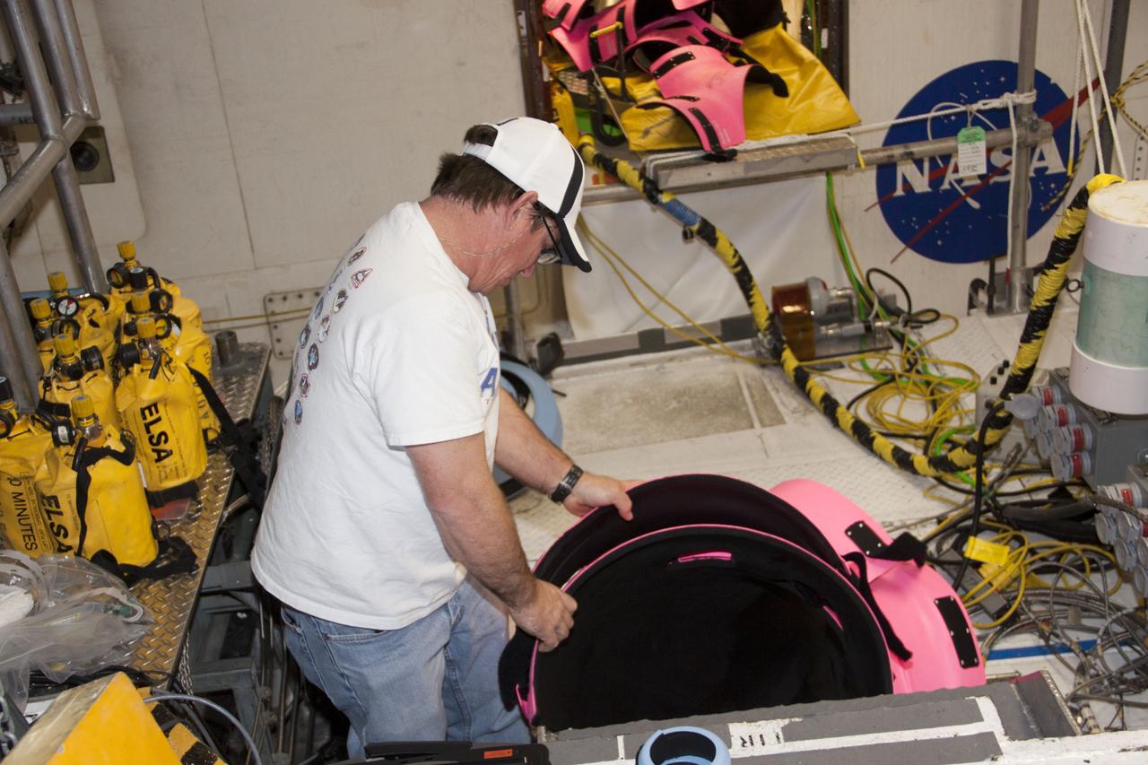 CAPE CANAVERAL, Fla. – Inside Orbiter Processing Facility-1 at NASA’s Kennedy Space Center in Florida, technicians prepare to remove space shuttle Discovery’s main propulsion system protective covers. The work is part of the Space Shuttle Program’s transition and retirement processing of shuttle Discovery, which is being prepared for display at Smithsonian’s National Air and Space Museum, Steven F. Udvar-Hazy Center in Chantilly, Va. Discovery is scheduled to be transported atop a NASA Shuttle Carrier Aircraft modified 747 jet to Dulles International Airport in Virginia on April 17 and then moved to the Smithsonian for permanent public display on April 19. For more information, visit http://www.nasa.gov/shuttle. Photo credit: NASA/Jim Grossmann