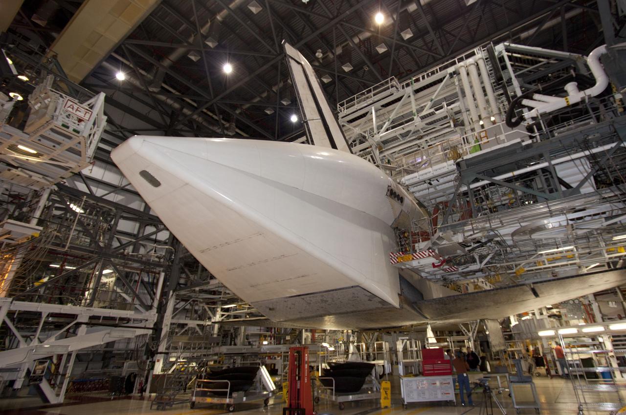CAPE CANAVERAL, Fla. – Inside Orbiter Processing Facility-1 at NASA’s Kennedy Space Center in Florida, technicians prepare to install the ferry flight doors on space shuttle Discovery.     The work is part of the Space Shuttle Program’s transition and retirement processing of shuttle Discovery, which is being prepared for display at Smithsonian’s National Air and Space Museum, Steven F. Udvar-Hazy Center in Chantilly, Va. Discovery is scheduled to be transported atop a NASA Shuttle Carrier Aircraft modified 747 jet to Dulles International Airport in Virginia on April 17 and then moved to the Smithsonian for permanent public display on April 19. For more information, visit http://www.nasa.gov/shuttle.  Photo credit: NASA/Jim Grossmann