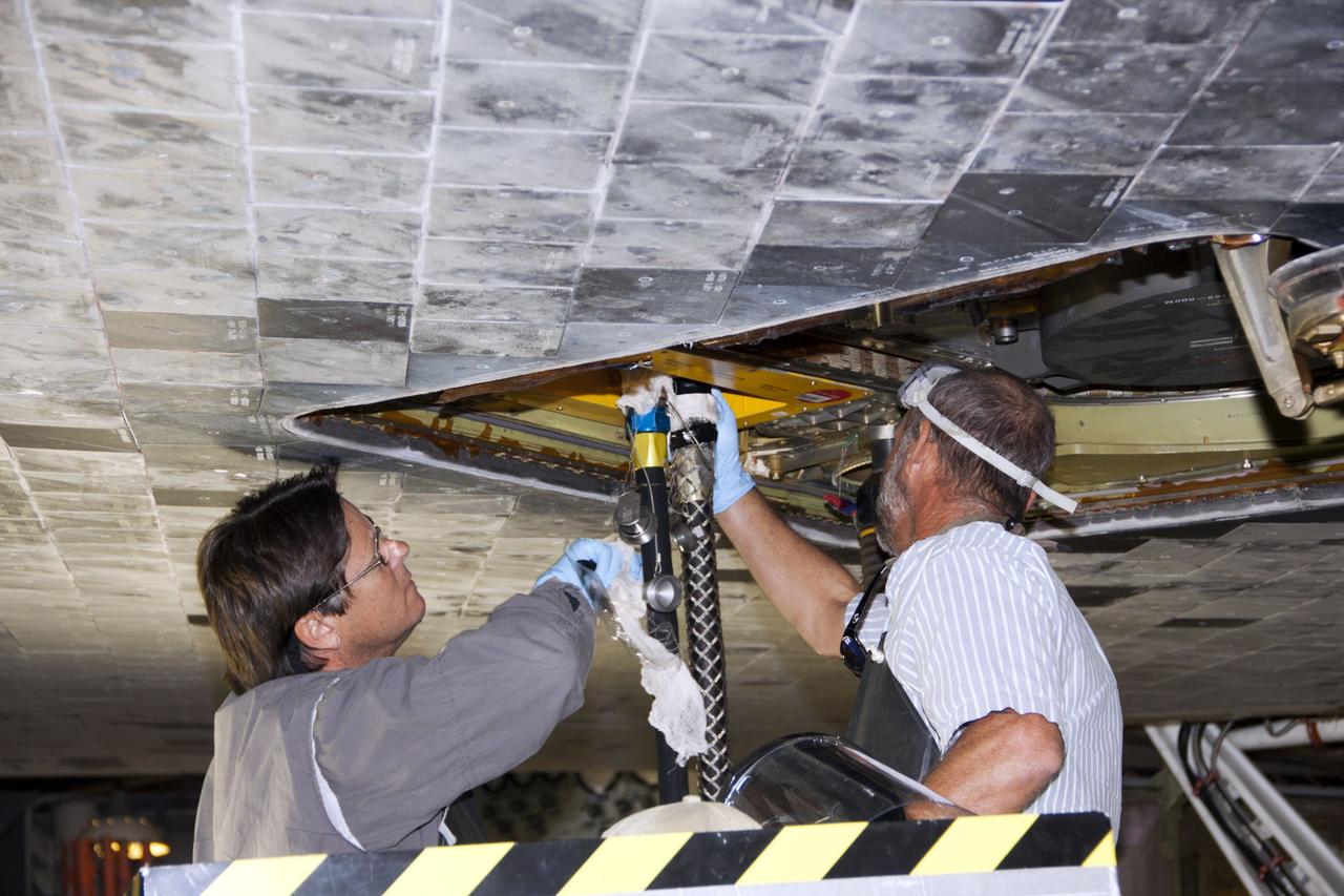 CAPE CANAVERAL, Fla. – Inside Orbiter Processing Facility-1 at NASA’s Kennedy Space Center in Florida, technicians prepare to install the ferry flight doors on space shuttle Discovery.     The work is part of the Space Shuttle Program’s transition and retirement processing of shuttle Discovery, which is being prepared for display at Smithsonian’s National Air and Space Museum, Steven F. Udvar-Hazy Center in Chantilly, Va. Discovery is scheduled to be transported atop a NASA Shuttle Carrier Aircraft modified 747 jet to Dulles International Airport in Virginia on April 17 and then moved to the Smithsonian for permanent public display on April 19. For more information, visit http://www.nasa.gov/shuttle.  Photo credit: NASA/Jim Grossmann