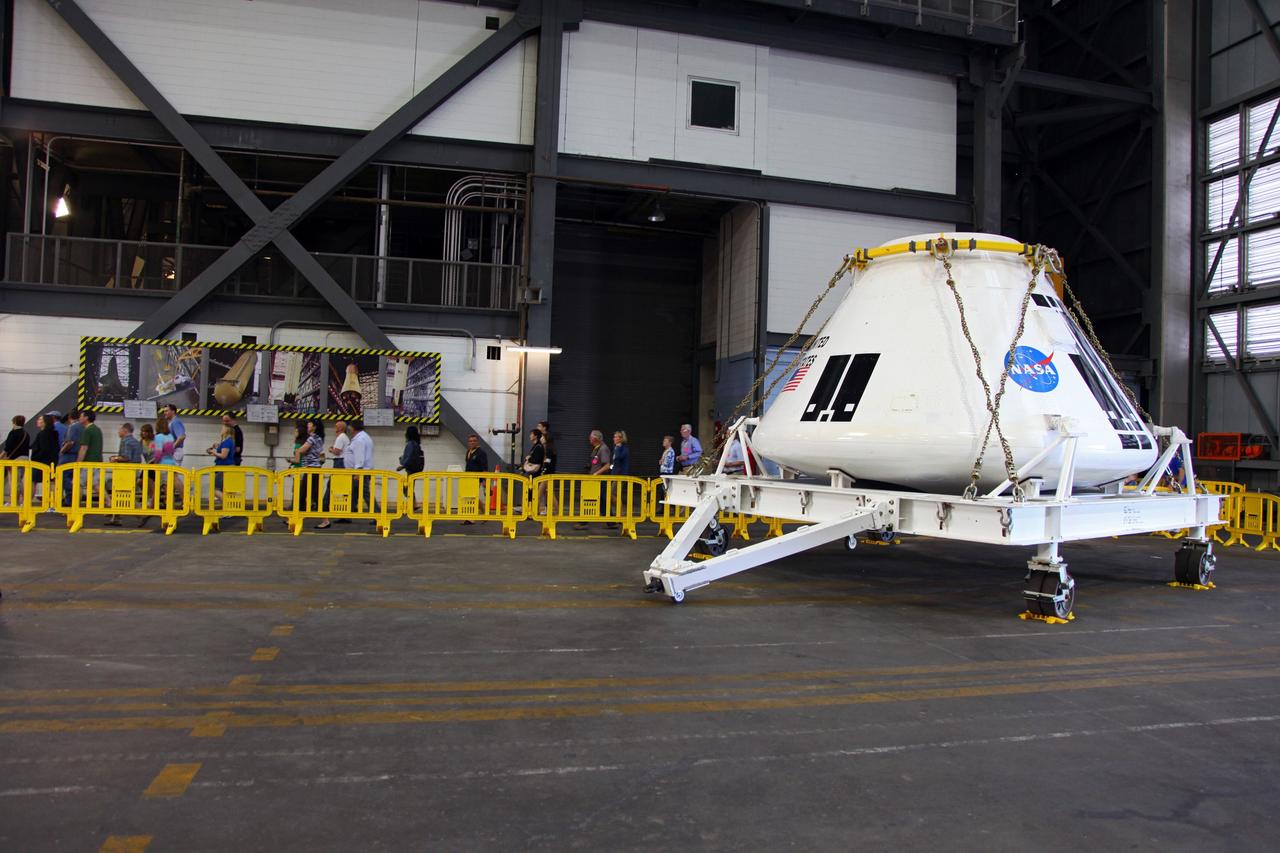 CAPE CANAVERAL, Fla. – A full-scale test version of NASA's new Orion Multi-Purpose Crew Vehicle is on display inside the Vehicle Assembly Building VAB for visitors on a bus tour originating from the Kennedy Space Center Visitor Complex. NASA’s Orion spacecraft, under development, will take astronauts farther into space than ever before.    Public tours inside the VAB are being offered regularly through Delaware North Companies Parks and Resorts, the concessionaire managing Kennedy’s visitor complex. For more information, visit http://www.nasa.gov/kennedy.  Photo credit: NASA/Frankie Martin