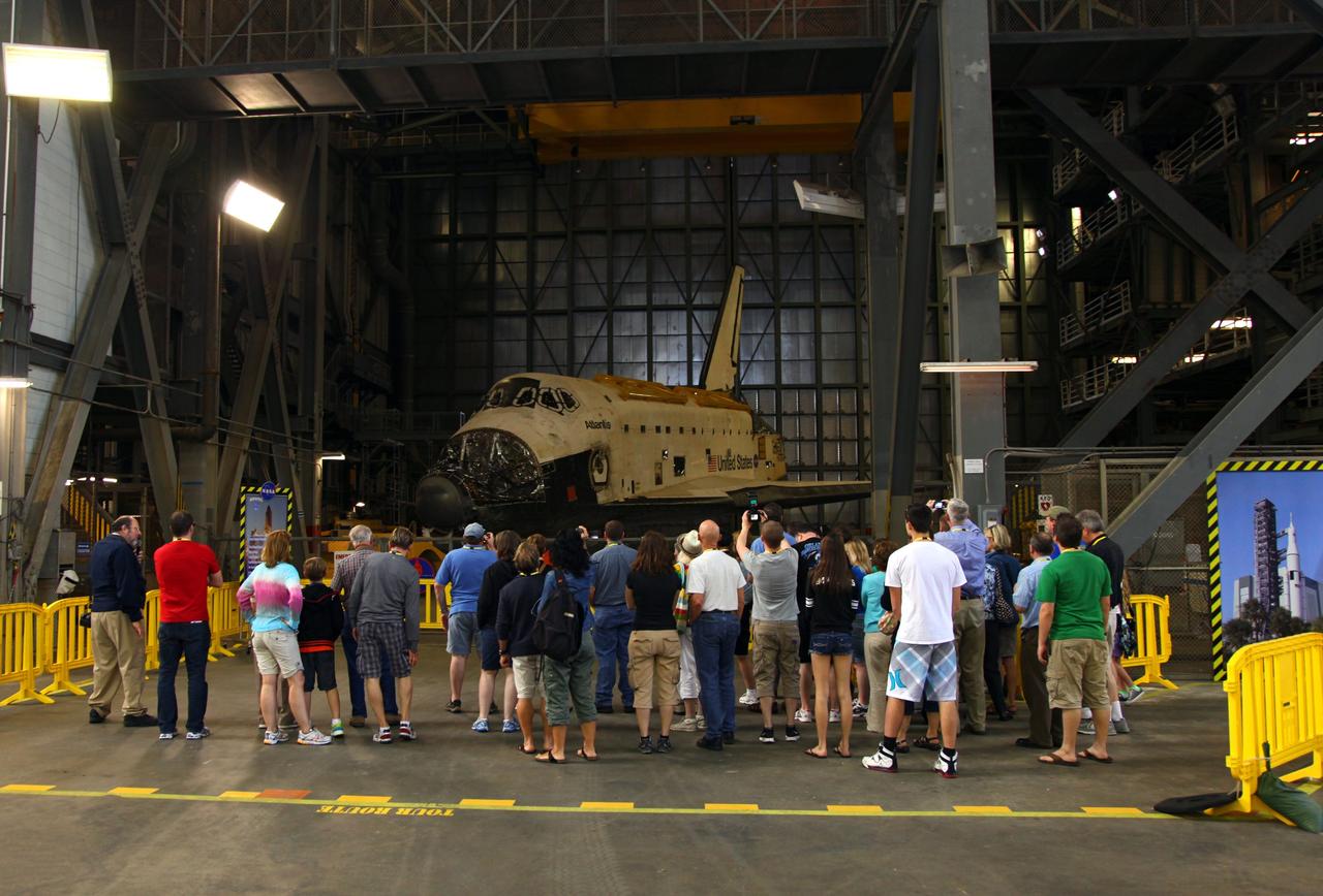 CAPE CANAVERAL, Fla. – Visitors to NASA’s Kennedy Space Center are given the opportunity to view space shuttle Atlantis, which is in storage in High Bay 4 of the Vehicle Assembly Building VAB, during a bus tour originating from the Kennedy Space Center Visitor Complex. The shuttles are undergoing refurbishment for their transfer to locations around the country following the end of the Space Shuttle Program. Atlantis will be displayed in 2013 in a new facility under construction at Kennedy’s visitor complex. Public tours inside the VAB are being offered regularly through Delaware North Companies Parks and Resorts, the concessionaire managing Kennedy’s visitor complex. For more information, visit http://www.nasa.gov/kennedy. Photo credit: NASA/Frankie Martin