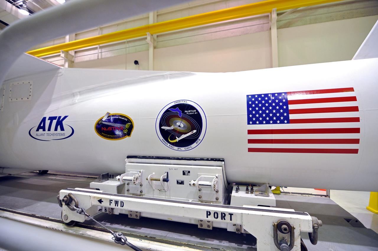 VANDENBERG AIR FORCE BASE, Calif. – Inside the Orbital Sciences processing facility at Vandenberg Air Force Base in California, preparations to launch NASA's Nuclear Spectroscopic Telescope Array, or NuSTAR, are nearly complete. The spacecraft has been mated with its Pegasus XL rocket and enclosed in the Pegasus payload fairing.    The fairing will protect the spacecraft from the heat and aerodynamic pressure generated during the rocket’s ascent to orbit.  After processing of the rocket and spacecraft are complete, they will be flown on Orbital's L-1011 carrier aircraft from Vandenberg to the Ronald Reagan Ballistic Missile Defense Test Site on the Pacific Ocean’s Kwajalein Atoll for launch in March. The high-energy X-ray telescope will conduct a census of black holes, map radioactive material in young supernovae remnants, and study the origins of cosmic rays and the extreme physics around collapsed stars. For more information, visit http://www.nasa.gov/nustar.  Photo credit: NASA/Randy Beaudoin, VAFB