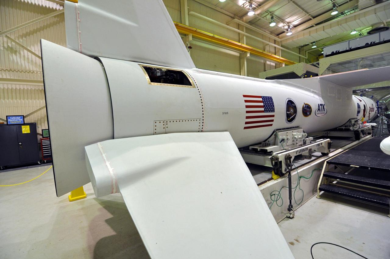 VANDENBERG AIR FORCE BASE, Calif. – Inside the Orbital Sciences processing facility at Vandenberg Air Force Base in California, Orbital’s Pegasus XL rocket awaits launch. The rocket has been mated with NASA's Nuclear Spectroscopic Telescope Array, or NuSTAR, and the spacecraft enclosed in the Pegasus payload fairing on the forward end of the rocket, at right. The fairing will protect the spacecraft from the heat and aerodynamic pressure generated during the rocket’s ascent to orbit. After processing of the rocket and spacecraft are complete, they will be flown on Orbital's L-1011 carrier aircraft from Vandenberg to the Ronald Reagan Ballistic Missile Defense Test Site on the Pacific Ocean’s Kwajalein Atoll for launch in March. The high-energy X-ray telescope will conduct a census of black holes, map radioactive material in young supernovae remnants, and study the origins of cosmic rays and the extreme physics around collapsed stars. For more information, visit http://www.nasa.gov/nustar. Photo credit: NASA/Randy Beaudoin, VAFB