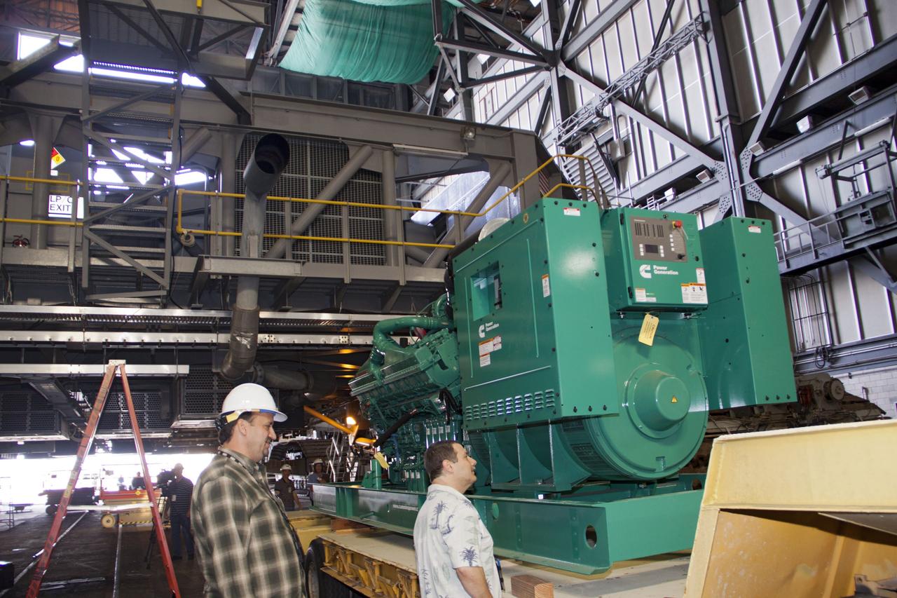 CAPE CANAVERAL, Fla. – Inside the Vehicle Assembly Building at NASA’s Kennedy Space Center in Florida, new engines and generators have arrived for installation on crawler-transporter 2 CT-2). The Apollo era diesel engines were removed last month. Work continues in high bay 2 to upgrade CT-2 so that it can carry NASA’s Space Launch System heavy-lift rocket, which is under design, and new Orion spacecraft to the launch pad. The crawler-transporters were used to carry the mobile launcher platform and space shuttle to Launch Complex 39 for space shuttle launches for 30 years. Photo credit: NASA/Jim Grossmann