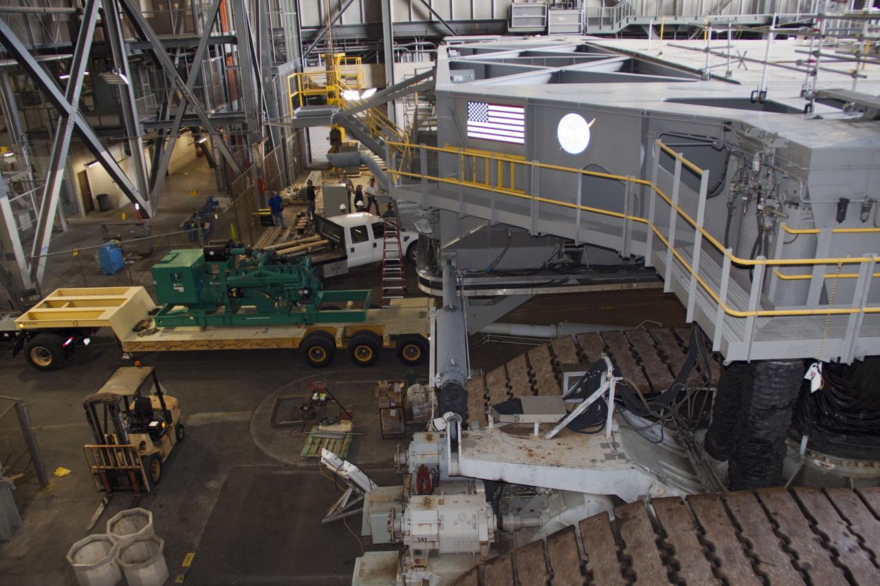 CAPE CANAVERAL, Fla. – Inside the Vehicle Assembly Building at NASA’s Kennedy Space Center in Florida, a new engine and generator have arrived for installation on crawler-transporter 2 CT-2). The Apollo era diesel engines were removed last month. Work continues in high bay 2 to upgrade CT-2 so that it can carry NASA’s Space Launch System heavy-lift rocket, which is under design, and new Orion spacecraft to the launch pad. The crawler-transporters were used to carry the mobile launcher platform and space shuttle to Launch Complex 39 for space shuttle launches for 30 years. Photo credit: NASA/Jim Grossmann