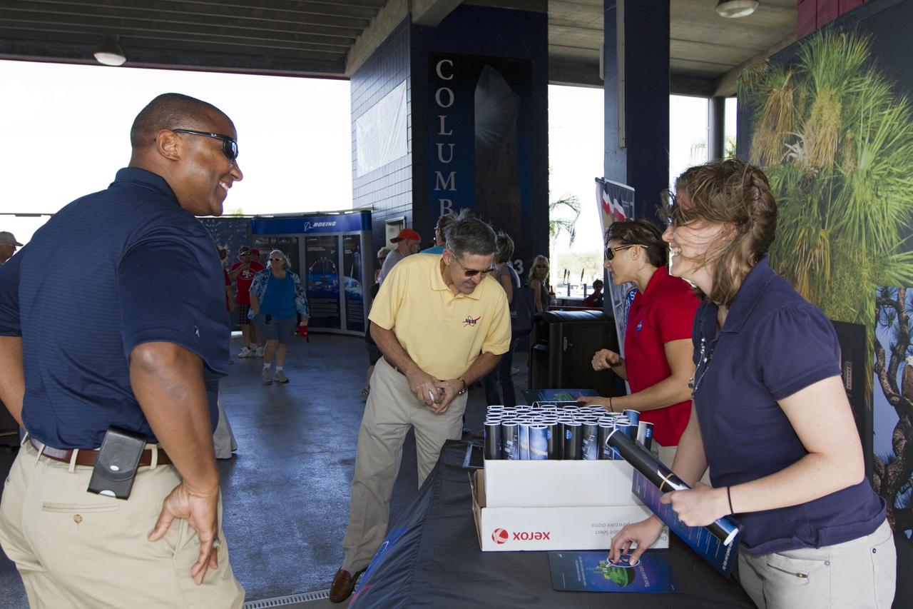 VIERA, Fla. – From left, Kelvin Manning, associate director of NASA’s Kennedy Space Center, and Bob Cabana, director of the center, visit the NASA booth on Space Day at the Space Coast Stadium where information on some of the contributions the space agency has made to sports, transportation and everyday life is being distributed to baseball fans attending the stadium’s Space Day. Cabana was on hand to throw the first pitch of a spring training game between Major League Baseball's Washington Nationals and the Houston Astros. A full-scale test version of NASA's new Orion Multi-Purpose Crew Vehicle was on display outside the stadium for the occasion to show the public the spacecraft under development that will take astronauts farther into space than ever before. For more information, visit http://www.nasa.gov/kennedy. Photo credit: NASA/Kim Shiflett