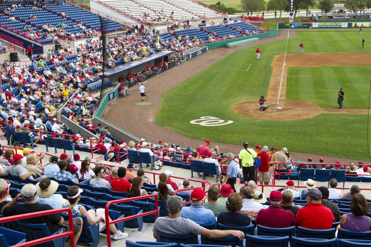 VIERA, Fla. – Baseball fans are on hand for Space Day at the Space Coast Stadium. Bob Cabana, director of NASA’s Kennedy Space Center in Florida, was on hand to throw the first pitch of a spring training game between Major League Baseball's Washington Nationals and the Houston Astros. Kennedy set up a booth at the stadium for the occasion to highlight some of the contributions the space agency has made to sports, transportation and everyday life. A full-scale test version of NASA's new Orion Multi-Purpose Crew Vehicle also was located outside the stadium to show the public the spacecraft under development that will take astronauts farther into space than ever before. For more information, visit http://www.nasa.gov/kennedy. Photo credit: NASA/Kim Shiflett
