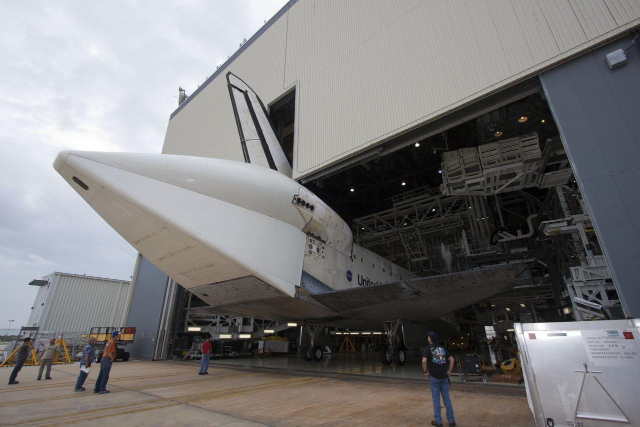 CAPE CANAVERAL, Fla. – At NASA’s Kennedy Space Center in Florida, space shuttle Discovery is backed out of Orbiter Processing Facility-1 for its move to the Vehicle Assembly Building VAB. The aft view of Discovery reveals the tail cone that covers the three replica shuttle main engines. The work is part of the Space Shuttle Program’s transition and retirement processing of shuttle Discovery, which is being prepared for display at Smithsonian’s National Air and Space Museum, Steven F. Udvar-Hazy Center in Chantilly, Va. Discovery will remain in high bay 4 of the VAB until its scheduled transport atop a NASA Shuttle Carrier Aircraft modified 747 jet to Dulles International Airport in Virginia on April 17. Discovery will then be transported to the Smithsonian on April 19. For more information, visit http://www.nasa.gov/shuttle. Photo credit: NASA/Jim Grossmann