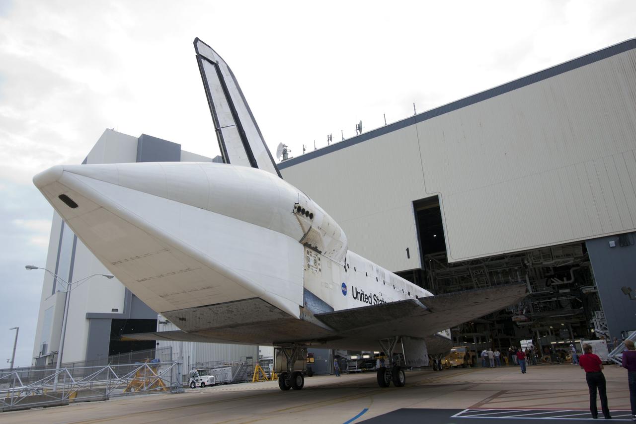 CAPE CANAVERAL, Fla. – At NASA’s Kennedy Space Center in Florida, space shuttle Discovery is backed out of Orbiter Processing Facility-1 for its move to the Vehicle Assembly Building VAB. The aft view of Discovery reveals the tail cone that covers the three replica shuttle main engines. The work is part of the Space Shuttle Program’s transition and retirement processing of shuttle Discovery, which is being prepared for display at Smithsonian’s National Air and Space Museum, Steven F. Udvar-Hazy Center in Chantilly, Va. Discovery will remain in high bay 4 of the VAB until its scheduled transport atop a NASA Shuttle Carrier Aircraft modified 747 jet to Dulles International Airport in Virginia on April 17. Discovery will then be transported to the Smithsonian on April 19. For more information, visit http://www.nasa.gov/shuttle. Photo credit: NASA/Jim Grossmann