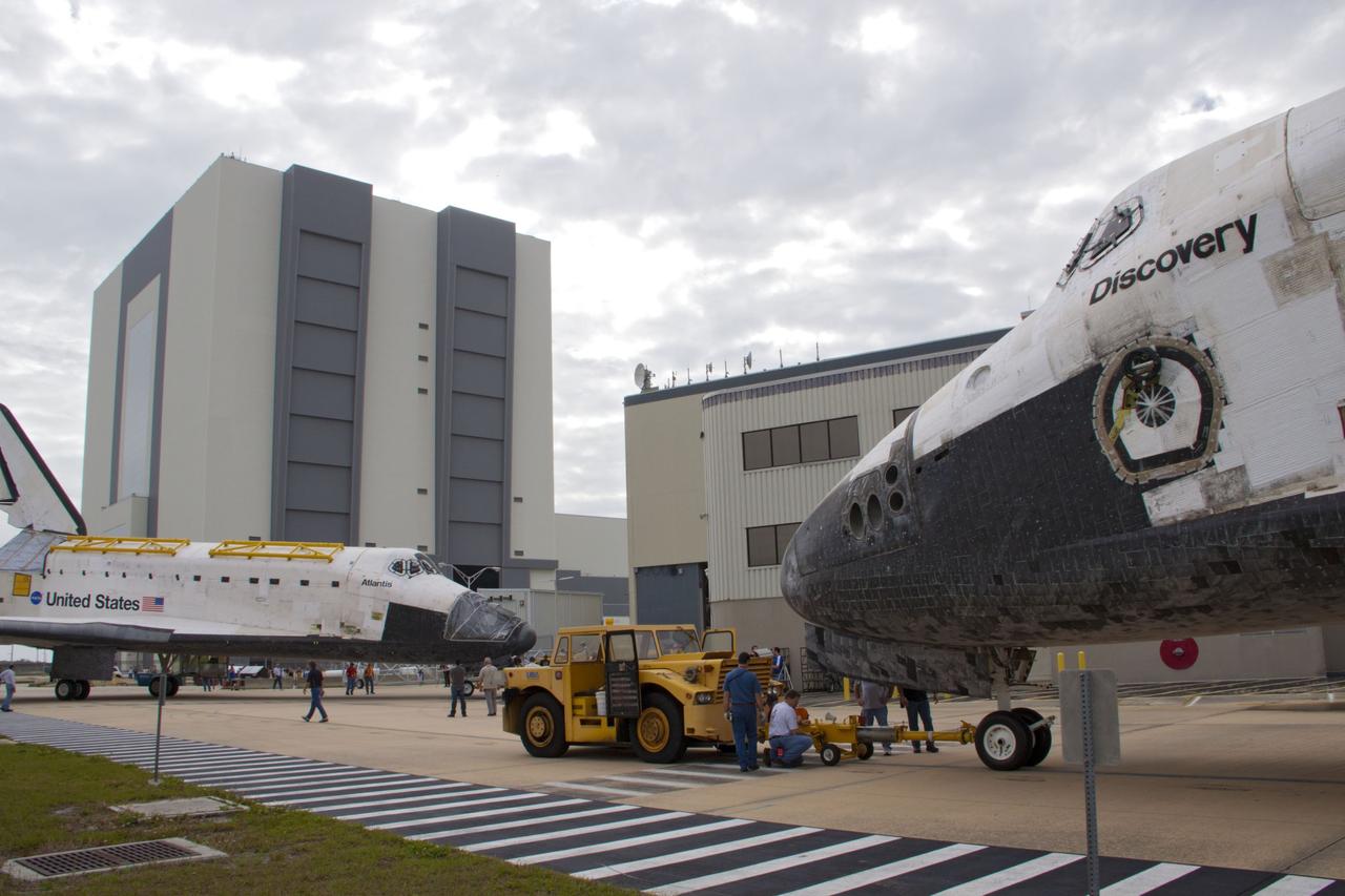 CAPE CANAVERAL, Fla. – At NASA’s Kennedy Space Center in Florida, space shuttle Discovery in the foreground and space shuttle Atlantis almost meet nose to nose. Discovery was towed out of Orbiter Processing Facility-1 for its move to the Vehicle Assembly Building VAB, while Atlantis was towed out of the VAB for its move to OPF-1. The work is part of the Space Shuttle Program’s transition and retirement processing of shuttle Discovery, which is being prepared for display at Smithsonian’s National Air and Space Museum, Steven F. Udvar-Hazy Center in Chantilly, Va. Discovery will remain in high bay 4 of the VAB until its scheduled transport atop a NASA Shuttle Carrier Aircraft modified 747 jet to Dulles International Airport in Virginia on April 17. Discovery will then be transported to the Smithsonian on April 19. For more information, visit http://www.nasa.gov/shuttle. Photo credit: NASA/Jim Grossmann