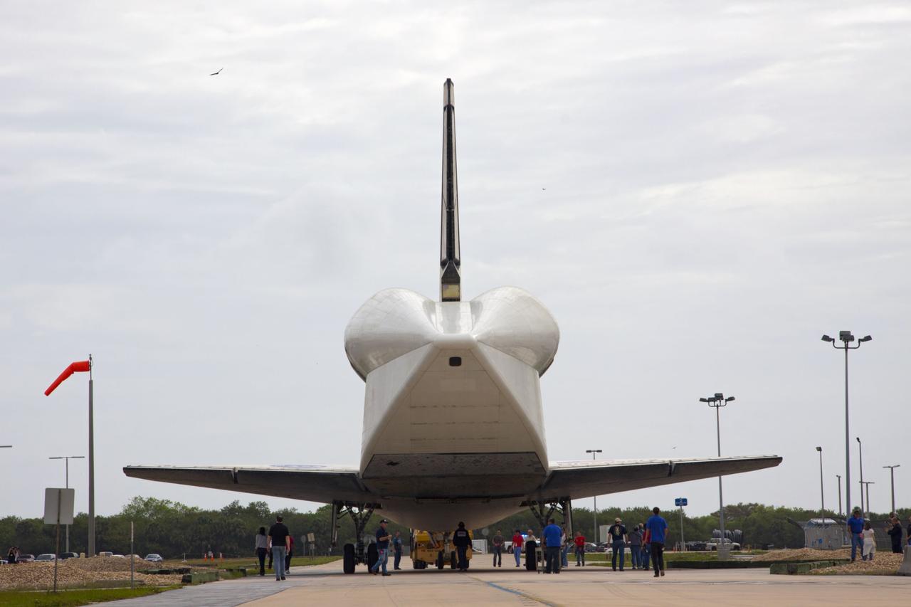 CAPE CANAVERAL, Fla. – At NASA’s Kennedy Space Center in Florida, space shuttle Discovery is towed to the Vehicle Assembly Building VAB after being towed out of Orbiter Processing Facility-1. The aft view of Discovery reveals the tail cone that covers the three replica shuttle main engines. The work is part of the Space Shuttle Program’s transition and retirement processing of shuttle Discovery, which is being prepared for display at Smithsonian’s National Air and Space Museum, Steven F. Udvar-Hazy Center in Chantilly, Va. Discovery will remain in high bay 4 of the VAB until its scheduled transport atop a NASA Shuttle Carrier Aircraft modified 747 jet to Dulles International Airport in Virginia on April 17. Discovery will then be transported to the Smithsonian on April 19. For more information, visit http://www.nasa.gov/shuttle. Photo credit: NASA/Jim Grossmann