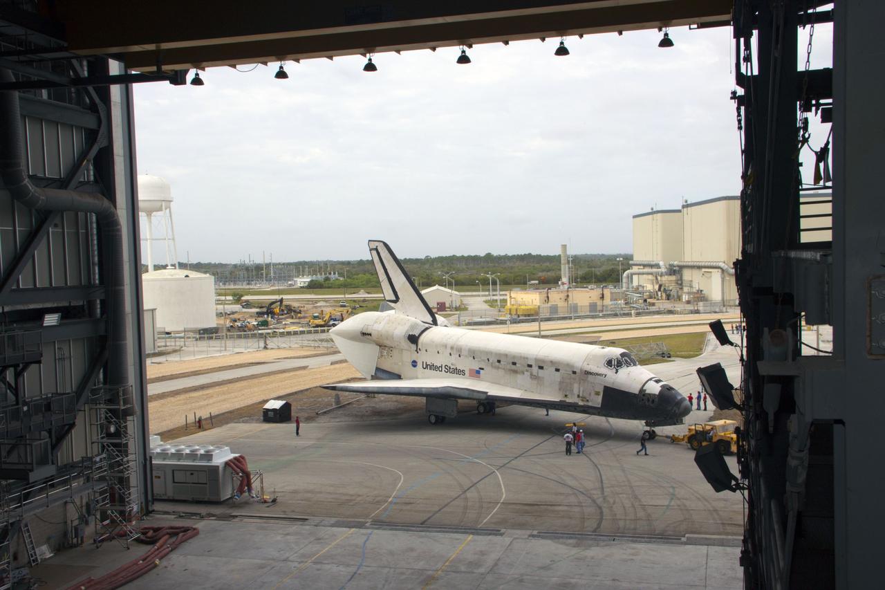 CAPE CANAVERAL, Fla. – Space shuttle Discovery is towed to the Vehicle Assembly Building VAB from Orbiter Processing Facility-1 at NASA’s Kennedy Space Center in Florida.      The work is part of the Space Shuttle Program’s transition and retirement processing of shuttle Discovery, which is being prepared for display at Smithsonian’s National Air and Space Museum, Steven F. Udvar-Hazy Center in Chantilly, Va. Discovery will remain in high bay 4 of the VAB until its scheduled transport atop a NASA Shuttle Carrier Aircraft modified 747 jet to Dulles International Airport in Virginia on April 17. Discovery will then be transported to the Smithsonian on April 19. For more information, visit http://www.nasa.gov/shuttle.  Photo credit: NASA/Jim Grossmann