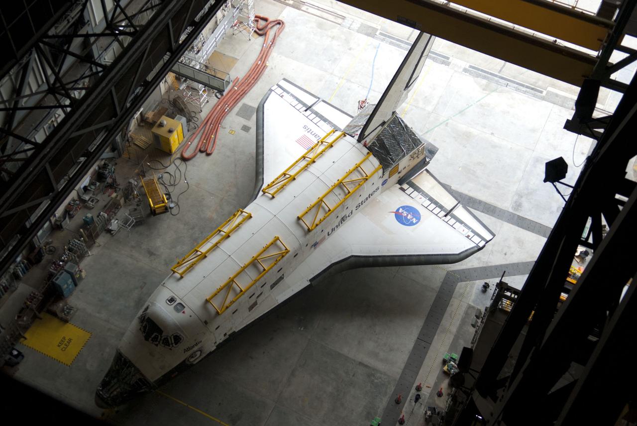 CAPE CANAVERAL, Fla. – Inside the Vehicle Assembly Building at NASA’s Kennedy Space Center in Florida, a view from above shows space shuttle Atlantis as it waits to be towed out of the transfer aisle and over to Orbiter Processing Facility-1. The work is part of the Space Shuttle Program’s transition and retirement processing of the three space shuttles. Atlantis is being prepared for display at the Kennedy Space Center Visitor Complex and is scheduled to rollover to the complex in November. Photo credit: NASA/Tim Jacobs