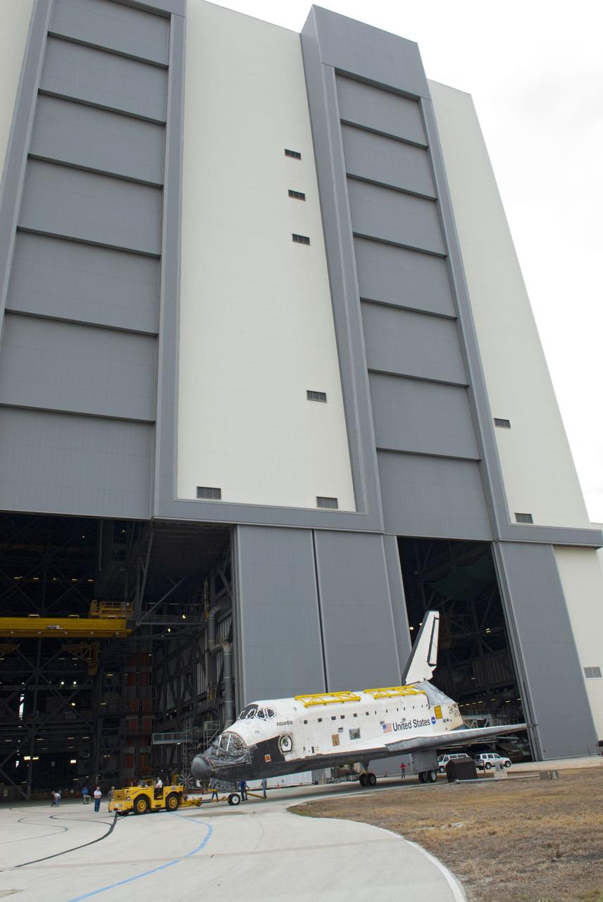 CAPE CANAVERAL, Fla. – At NASA’s Kennedy Space Center in Florida, space shuttle Atlantis is being towed from the Vehicle Assembly Building over to Orbiter Processing Facility-1. Atlantis’ forward reaction control system, orbiter maneuvering system pods and three space shuttle main engines have been removed. The work is part of the Space Shuttle Program’s transition and retirement processing of the three space shuttles. Atlantis is being prepared for display at the Kennedy Space Center Visitor Complex and is scheduled to rollover to the complex in November. Photo credit: NASA/Tim Jacobs