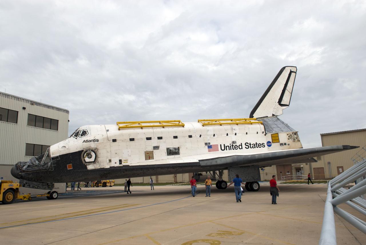 CAPE CANAVERAL, Fla. – At NASA’s Kennedy Space Center in Florida, space shuttle Atlantis is towed toward Orbiter Processing Facility-1 after being towed from the Vehicle Assembly Building. The work is part of the Space Shuttle Program’s transition and retirement processing of the three space shuttles. Atlantis is being prepared for display at the Kennedy Space Center Visitor Complex and is scheduled to rollover to the complex in November. Photo credit: NASA/Tim Jacobs
