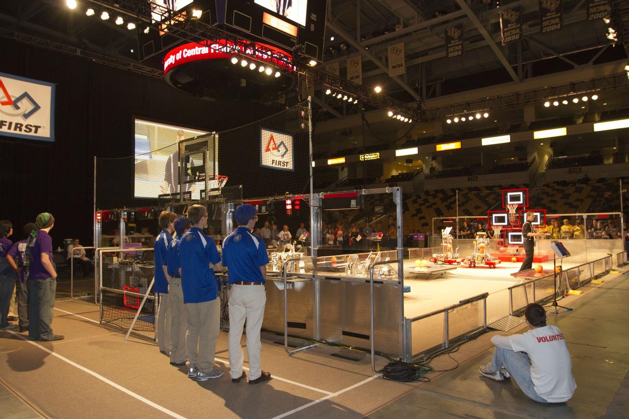 ORLANDO, Fla. -- High school teams compete in the regional FIRST robotics competition at the University of Central Florida in Orlando, Fla. More than 60 teams took part in the competition called "For Inspiration and Recognition of Science and Technology," or FIRST, in hopes of advancing to the national robotics championship. This year, the competition resembled a basketball game and was dubbed "Rebound Rumble." The game measured the effectiveness of each robot, the power of collaboration and the determination of the teams.    FIRST, founded in 1989, is a non-profit organization that designs accessible, innovative programs to build self-confidence, knowledge and life skills while motivating young people to pursue academic opportunities. The robotics competition challenges teams of high school students and their mentors to solve a common problem in a six-week timeframe using a standard kit of parts and a common set of rules. NASA is the largest sponsor of the international program. Kennedy Space Center is a sponsor of the regional event. For more information on Kennedy's education events and initiatives, go to http://www.nasa.gov/offices/education/centers/kennedy/home/index.html. Photo credit: NASA/Kim Shiflett