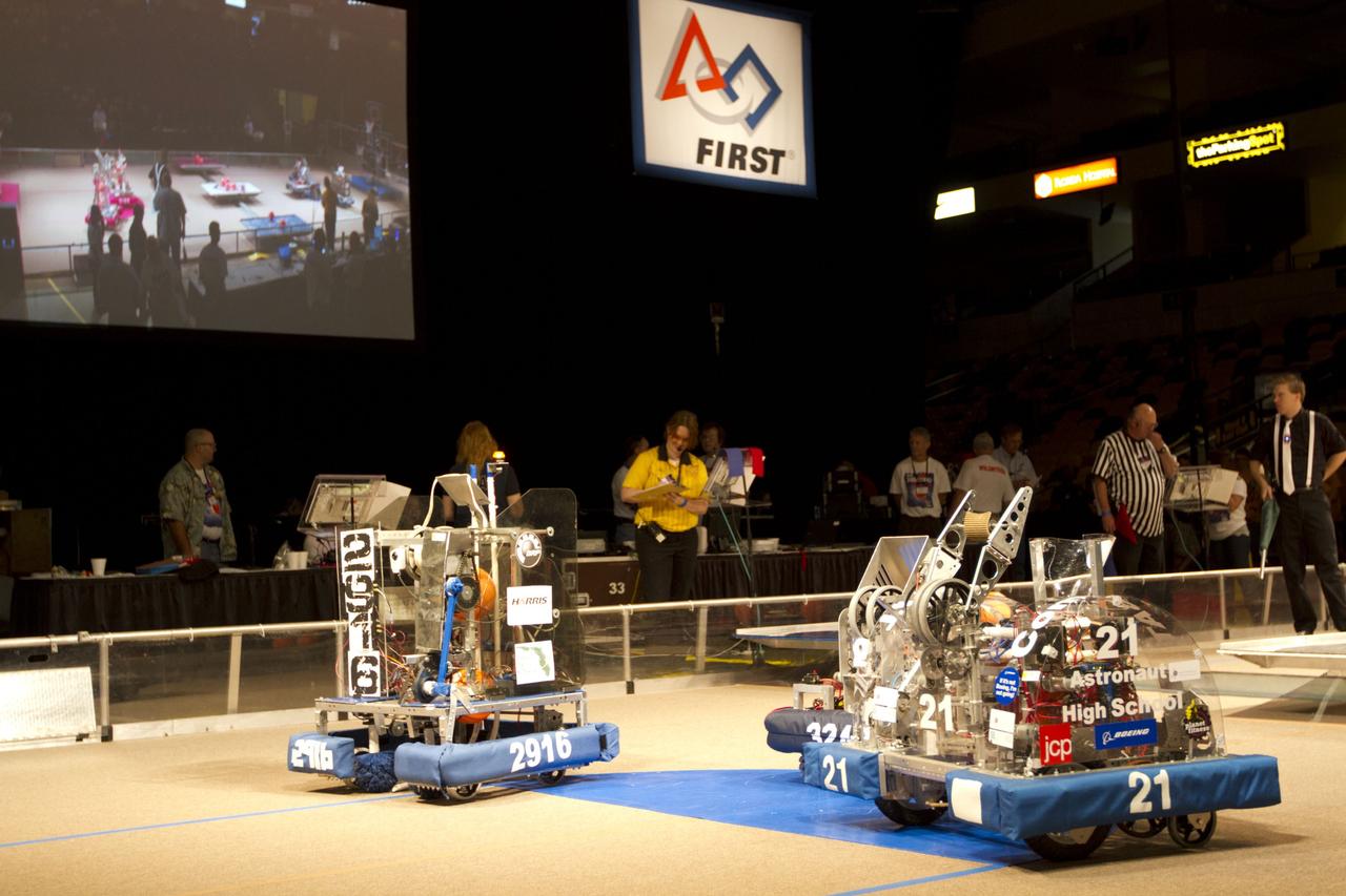 ORLANDO, Fla. -- High school teams compete in the regional FIRST robotics competition at the University of Central Florida in Orlando, Fla. More than 60 teams took part in the competition called "For Inspiration and Recognition of Science and Technology," or FIRST, in hopes of advancing to the national robotics championship. This year, the competition resembled a basketball game and was dubbed "Rebound Rumble." The game measured the effectiveness of each robot, the power of collaboration and the determination of the teams.      FIRST, founded in 1989, is a non-profit organization that designs accessible, innovative programs to build self-confidence, knowledge and life skills while motivating young people to pursue academic opportunities. The robotics competition challenges teams of high school students and their mentors to solve a common problem in a six-week timeframe using a standard kit of parts and a common set of rules. NASA is the largest sponsor of the international program. Kennedy Space Center is a sponsor of the regional event. For more information on Kennedy's education events and initiatives, go to http://www.nasa.gov/offices/education/centers/kennedy/home/index.html. Photo credit: NASA/Kim Shiflett