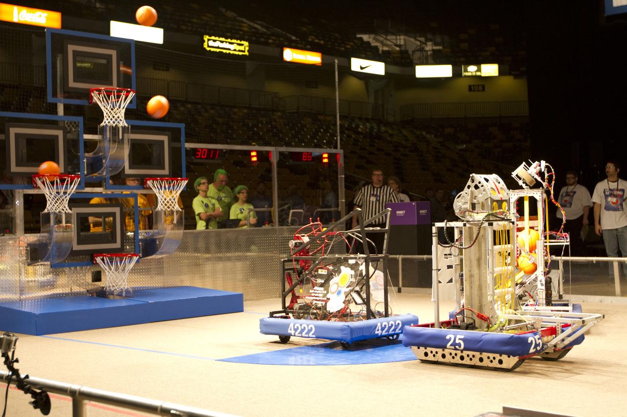 ORLANDO, Fla. -- High school teams compete in the regional FIRST robotics competition at the University of Central Florida in Orlando, Fla. More than 60 teams took part in the competition called "For Inspiration and Recognition of Science and Technology," or FIRST, in hopes of advancing to the national robotics championship. This year, the competition resembled a basketball game and was dubbed "Rebound Rumble." The game measured the effectiveness of each robot, the power of collaboration and the determination of the teams.    FIRST, founded in 1989, is a non-profit organization that designs accessible, innovative programs to build self-confidence, knowledge and life skills while motivating young people to pursue academic opportunities. The robotics competition challenges teams of high school students and their mentors to solve a common problem in a six-week timeframe using a standard kit of parts and a common set of rules. NASA is the largest sponsor of the international program. Kennedy Space Center is a sponsor of the regional event. For more information on Kennedy's education events and initiatives, go to http://www.nasa.gov/offices/education/centers/kennedy/home/index.html. Photo credit: NASA/Kim Shiflett