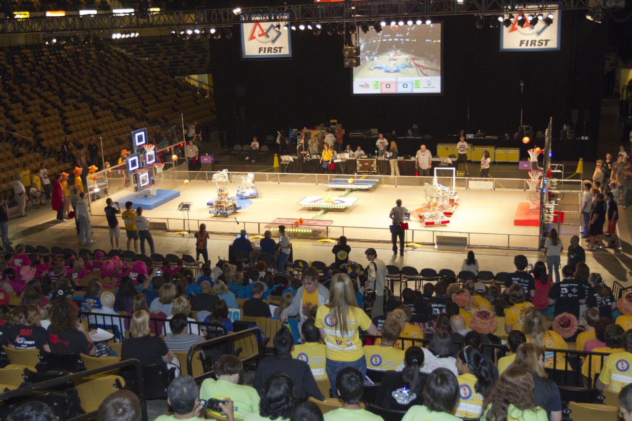 ORLANDO, Fla. -- High school teams compete in the regional FIRST robotics competition at the University of Central Florida in Orlando, Fla. More than 60 teams took part in the competition called "For Inspiration and Recognition of Science and Technology," or FIRST, in hopes of advancing to the national robotics championship. This year, the competition resembled a basketball game and was dubbed "Rebound Rumble." The game measured the effectiveness of each robot, the power of collaboration and the determination of the teams.      FIRST, founded in 1989, is a non-profit organization that designs accessible, innovative programs to build self-confidence, knowledge and life skills while motivating young people to pursue academic opportunities. The robotics competition challenges teams of high school students and their mentors to solve a common problem in a six-week timeframe using a standard kit of parts and a common set of rules. NASA is the largest sponsor of the international program. Kennedy Space Center is a sponsor of the regional event. For more information on Kennedy's education events and initiatives, go to http://www.nasa.gov/offices/education/centers/kennedy/home/index.html. Photo credit: NASA/Kim Shiflett