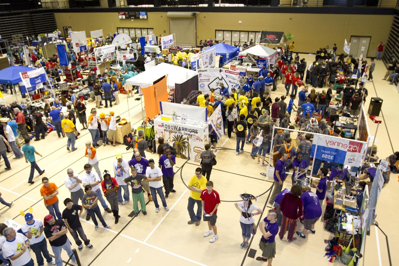 ORLANDO, Fla. -- High school teams tinker with their robots during the regional FIRST robotics competition at the University of Central Florida in Orlando, Fla. More than 50 teams took part in the competition called "For Inspiration and Recognition of Science and Technology," or FIRST, in hopes of advancing to the national robotics championship. This year, the competition resembled a basketball game and was dubbed "Rebound Rumble." The game measured the effectiveness of each robot, the power of collaboration and the determination of the teams.    FIRST, founded in 1989, is a non-profit organization that designs accessible, innovative programs to build self-confidence, knowledge and life skills while motivating young people to pursue academic opportunities. The robotics competition challenges teams of high school students and their mentors to solve a common problem in a six-week timeframe using a standard kit of parts and a common set of rules. NASA is the largest sponsor of the international program. Kennedy Space Center is a sponsor of the regional event. For more information on Kennedy's education events and initiatives, go to http://www.nasa.gov/offices/education/centers/kennedy/home/index.html. Photo credit: NASA/Kim Shiflett