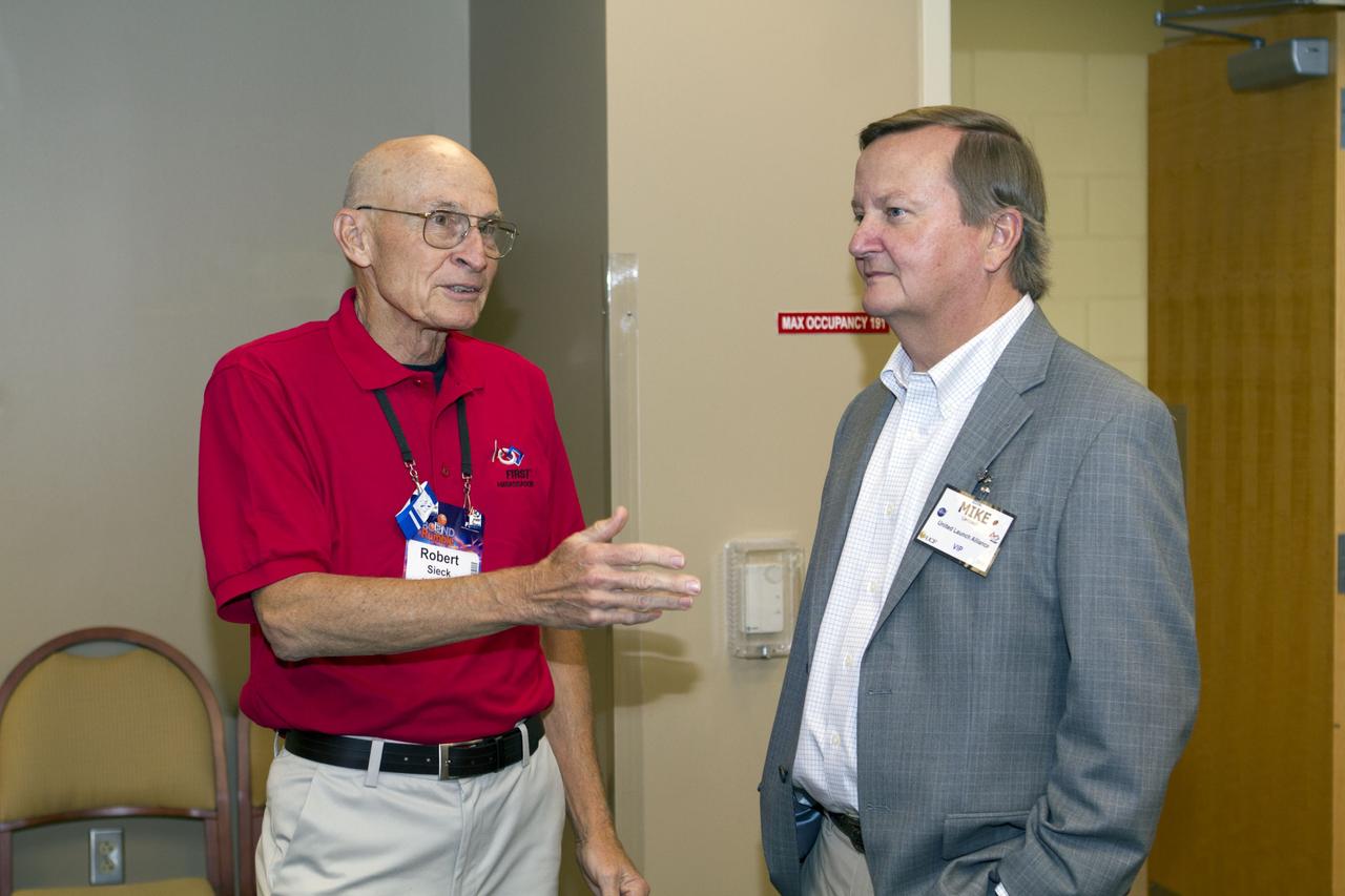 ORLANDO, Fla. -- Former space shuttle launch directors, Bob Sieck, left, and Mike Leinbach, right, talk with high school teams that are competing in the regional FIRST robotics competition at the University of Central Florida in Orlando, Fla. More than 60 teams took part in the competition called "For Inspiration and Recognition of Science and Technology," or FIRST, in hopes of advancing to the national robotics championship. This year, the competition resembled a basketball game and was dubbed "Rebound Rumble." The game measured the effectiveness of each robot, the power of collaboration and the determination of the teams.    FIRST, founded in 1989, is a non-profit organization that designs accessible, innovative programs to build self-confidence, knowledge and life skills while motivating young people to pursue academic opportunities. The robotics competition challenges teams of high school students and their mentors to solve a common problem in a six-week timeframe using a standard kit of parts and a common set of rules. NASA is the largest sponsor of the international program. Kennedy Space Center is a sponsor of the regional event. For more information on Kennedy's education events and initiatives, go to http://www.nasa.gov/offices/education/centers/kennedy/home/index.html. Photo credit: NASA/Kim Shiflett