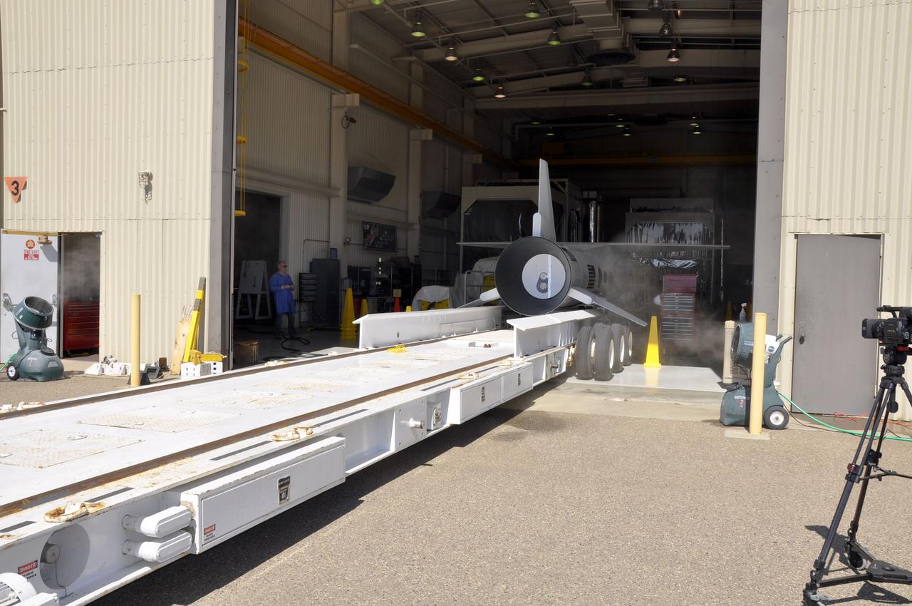 VANDENBERG AIR FORCE BASE, Calif. – Preparations are under way to transfer an Orbital Sciences Pegasus XL rocket onto the transporter in Orbital’s hangar at Vandenberg Air Force Base in California. The rocket has been mated to NASA's Nuclear Spectroscopic Telescope Array, or NuSTAR, encapsulated in the Pegasus payload fairing. The transporter will move them to the runway ramp where they will be attached to the underside of Orbital’s L-1011 carrier aircraft. The aircraft will fly the pair from Vandenberg to the Ronald Reagan Ballistic Missile Defense Test Site on the Pacific Ocean’s Kwajalein Atoll for launch. A revised launch date will be set at the Flight Readiness Review, planned for later this week. The high-energy X-ray telescope will conduct a census of black holes, map radioactive material in young supernovae remnants, and study the origins of cosmic rays and the extreme physics around collapsed stars. For more information, visit http://www.nasa.gov/nustar. Photo credit: NASA/Randy Beaudoin, VAFB