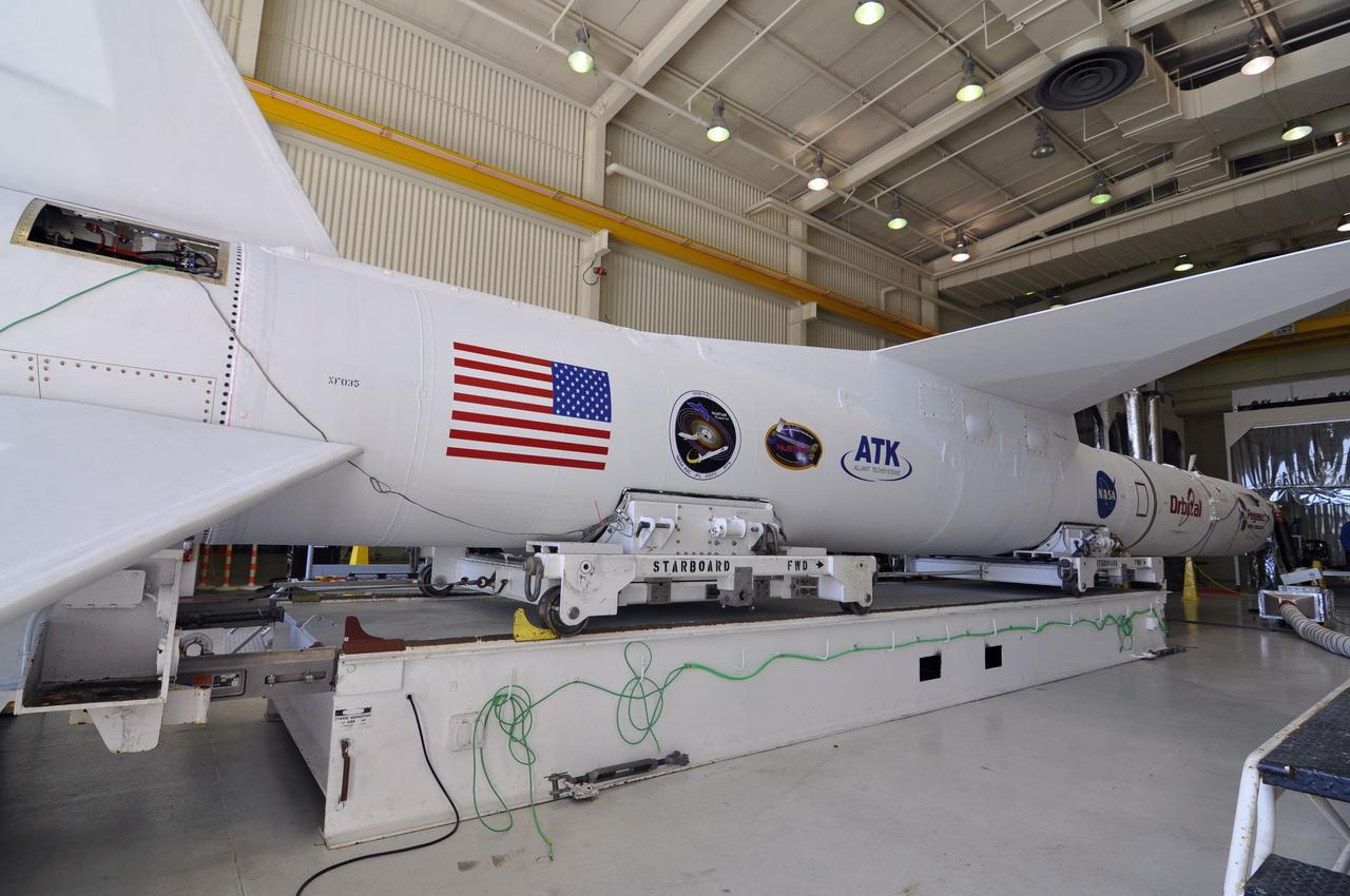 VANDENBERG AIR FORCE BASE, Calif. – An Orbital Sciences Pegasus XL rocket rests on the transporter in Orbital’s hangar at Vandenberg Air Force Base in California. The rocket has been mated to NASA's Nuclear Spectroscopic Telescope Array, or NuSTAR, encapsulated in a Pegasus payload fairing. The transporter will move them to the runway ramp where they will be attached to the underside of Orbital’s L-1011 carrier aircraft. The aircraft will fly the pair from Vandenberg to the Ronald Reagan Ballistic Missile Defense Test Site on the Pacific Ocean’s Kwajalein Atoll for launch. A revised launch date will be set at the Flight Readiness Review, planned for later this week. The high-energy X-ray telescope will conduct a census of black holes, map radioactive material in young supernovae remnants, and study the origins of cosmic rays and the extreme physics around collapsed stars. For more information, visit http://www.nasa.gov/nustar. Photo credit: NASA/Randy Beaudoin, VAFB