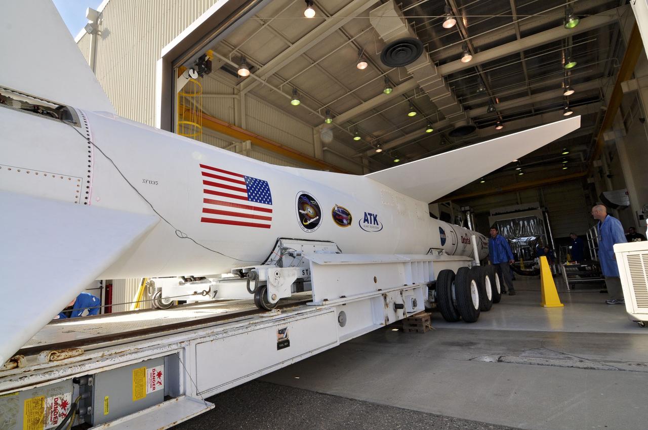 VANDENBERG AIR FORCE BASE, Calif. – The transporter for the Orbital Sciences Pegasus XL rocket moves through the open door of Orbital’s hangar at Vandenberg Air Force Base in California. The rocket is mated to NASA's Nuclear Spectroscopic Telescope Array, or NuSTAR, encapsulated in the Pegasus payload fairing. The transporter will move them to the runway ramp where they will be attached to the underside of Orbital’s L-1011 carrier aircraft. The aircraft will fly the pair from Vandenberg to the Ronald Reagan Ballistic Missile Defense Test Site on the Pacific Ocean’s Kwajalein Atoll for launch. A revised launch date will be set at the Flight Readiness Review, planned for later this week. The high-energy X-ray telescope will conduct a census of black holes, map radioactive material in young supernovae remnants, and study the origins of cosmic rays and the extreme physics around collapsed stars. For more information, visit http://www.nasa.gov/nustar. Photo credit: NASA/Randy Beaudoin, VAFB