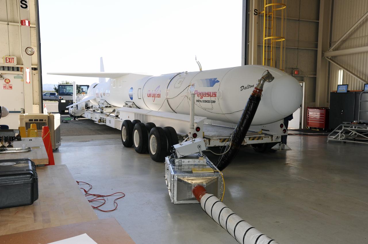 VANDENBERG AIR FORCE BASE, Calif. – At Vandenberg Air Force Base in California, the Orbital Science’s Pegasus LX has been moved onto a transporter inside Orbital’s hangar. The rocket is mated to NASA’s encapsulated Nuclear Spectroscopic Telescope Array, or NuSTAR, spacecraft. The transporter will move them to the runway ramp where they will be attached to the underside of Orbital’s L-1011 carrier aircraft. The aircraft will fly the pair from Vandenberg to the Ronald Reagan Ballistic Missile Defense Test Site on the Pacific Ocean’s Kwajalein Atoll for launch. A revised launch date is expected to be set at the Flight Readiness Review. The high-energy X-ray telescope will conduct a census of black holes, map radioactive material in young supernovae remnants, and study the origins of cosmic rays and the extreme physics around collapsed stars. For more information, visit http://www.nasa.gov/nustar. Photo credit: NASA/Mark Mackiey