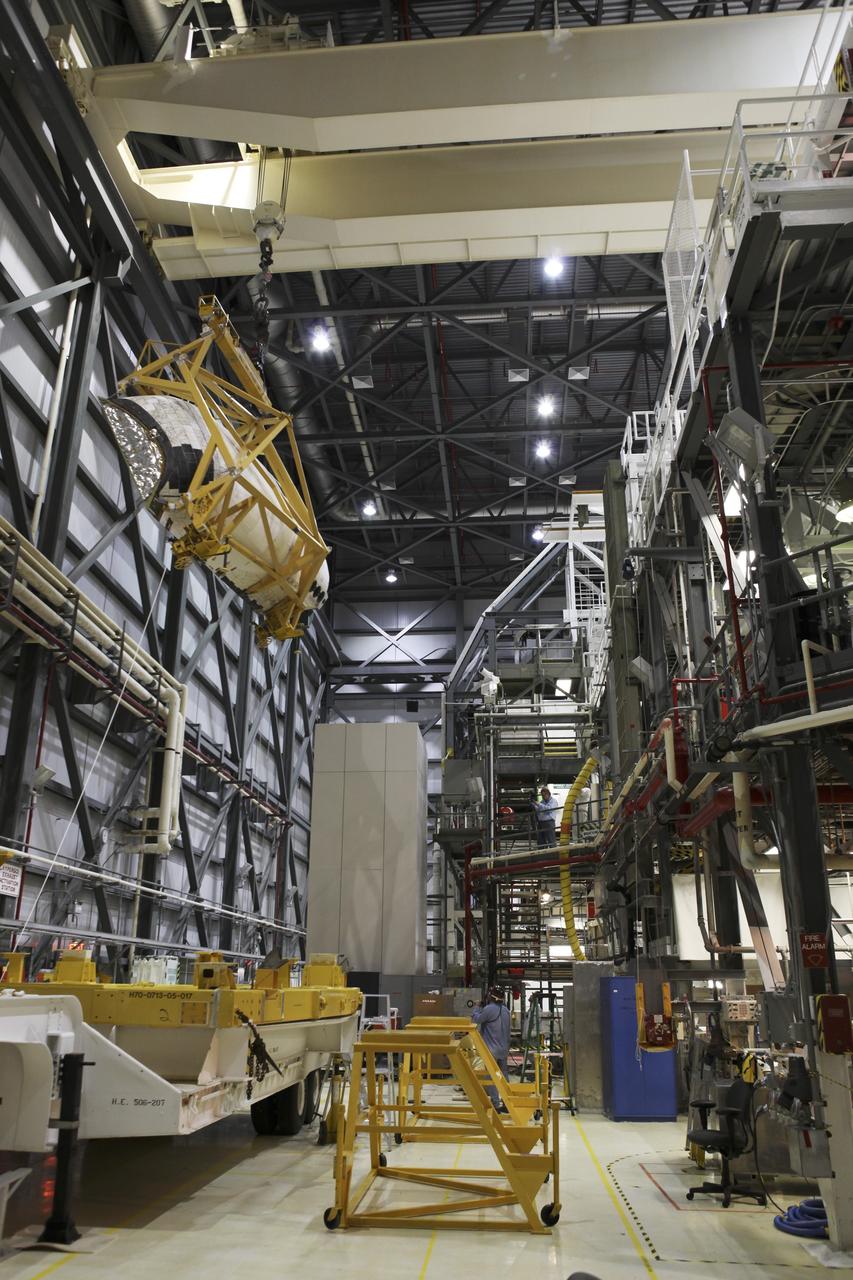 CAPE CANAVERAL, Fla. -- In Orbiter Processing Facility-2 at NASA's Kennedy Space Center in Florida, United Space Alliance technicians position the left orbital maneuvering system OMS pod for reinstallation on space shuttle Endeavour. The OMS pod underwent a complete deservicing and cleaning at White Sands Space Harbor in New Mexico, part of the shuttle’s transition and retirement processing. Endeavour is being prepared for public display at the California Science Center in Los Angeles. Over the course of its 19-year career, Endeavour spent 299 days in space during 25 missions. For more information, visit http://www.nasa.gov/shuttle. Photo credit: NASA/Dimitri Gerondidakis