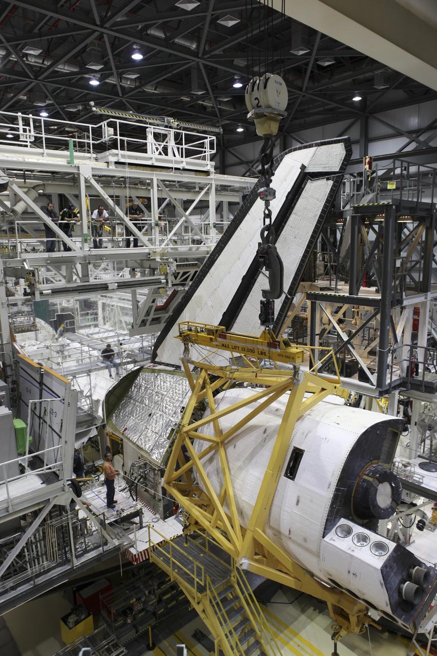 CAPE CANAVERAL, Fla. – Slowly, space shuttle Endeavour’s left orbital maneuvering system OMS pod glides into position alongside the shuttle in Orbiter Processing Facility-2 at NASA's Kennedy Space Center in Florida. The OMS pod is being reinstalled on Endeavour following a complete deservicing and cleaning at White Sands Space Harbor in New Mexico, part of the shuttle’s transition and retirement processing. Endeavour is being prepared for public display at the California Science Center in Los Angeles. Over the course of its 19-year career, Endeavour spent 299 days in space during 25 missions. For more information, visit http://www.nasa.gov/shuttle. Photo credit: NASA/Dimitri Gerondidakis