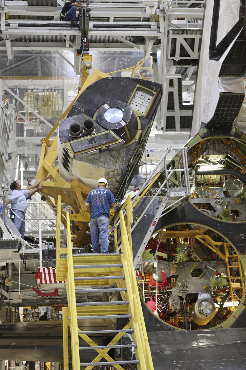 CAPE CANAVERAL, Fla. -- In Orbiter Processing Facility-2 at NASA's Kennedy Space Center in Florida, space shuttle Endeavour’s left orbital maneuvering system OMS pod is in position on the aft of the shuttle and ready for installation. The OMS pod underwent complete deservicing and cleaning at White Sands Space Harbor in New Mexico, part of the transition and retirement processing of each shuttle. Endeavour is being prepared for public display at the California Science Center in Los Angeles. Over the course of its 19-year career, Endeavour spent 299 days in space during 25 missions. For more information, visit http://www.nasa.gov/shuttle. Photo credit: NASA/Dimitri Gerondidakis