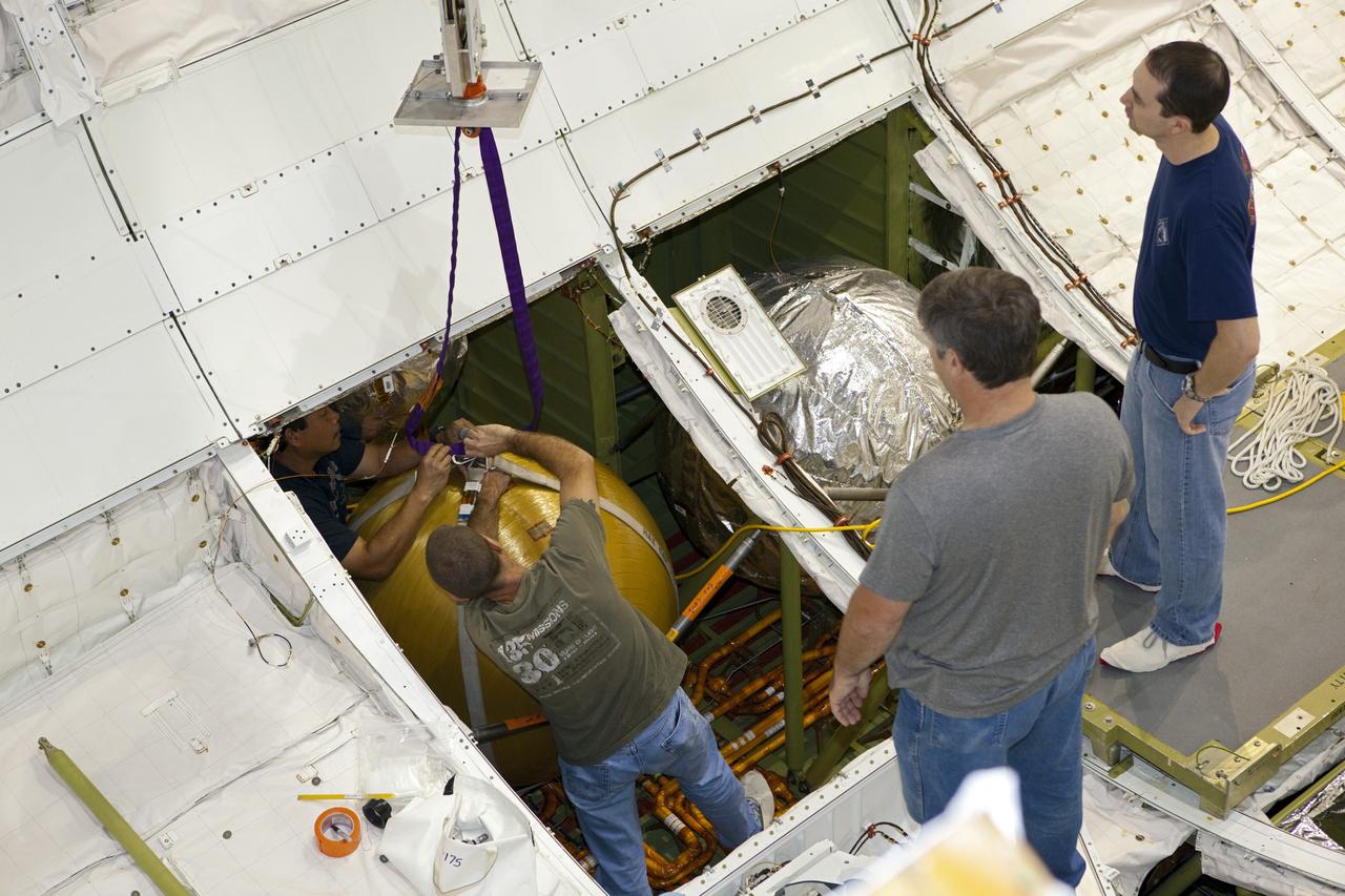 CAPE CANAVERAL, Fla. -- In Orbiter Processing Facility-2 at NASA’s Kennedy Space Center in Florida, United Space Alliance technicians begin to remove the main propulsion system tanks from space shuttle Endeavour’s mid-body. The tanks will be retained for possible future use on the agency’s Space Launch System Program. The work is part of Endeavour’s transition and retirement processing. The spacecraft is being prepared for public display at the California Science Center in Los Angeles. Endeavour flew 25 missions, spent 299 days in space, orbited Earth 4,671 times and traveled 122, 883, 151 miles over the course of its 19-year career. For more information, visit http://www.nasa.gov/shuttle. Photo credit: Dimitri Gerondidakis