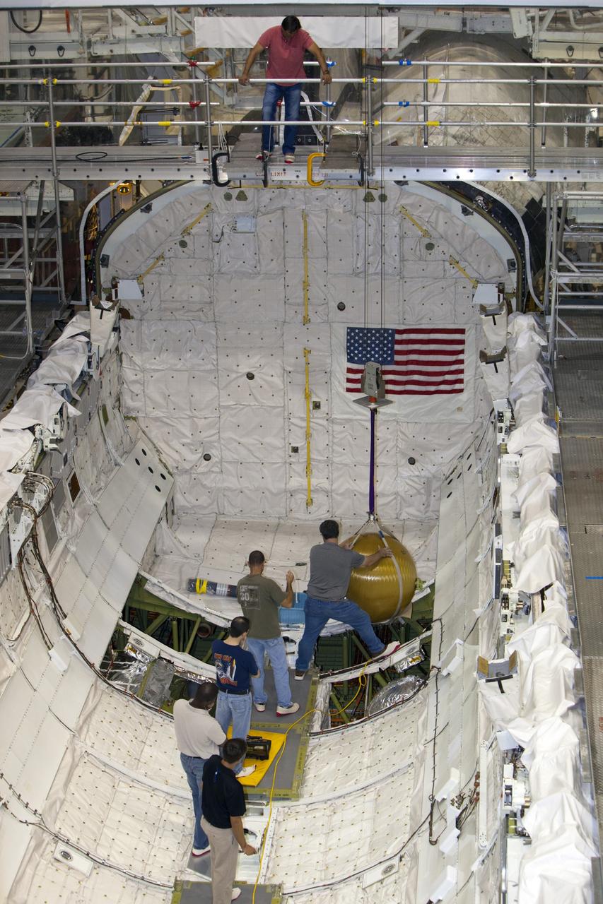 CAPE CANAVERAL, Fla. -- In Orbiter Processing Facility-2 at NASA’s Kennedy Space Center in Florida, United Space Alliance technicians remove the main propulsion system tanks from space shuttle Endeavour’s mid-body. The tanks will be retained for possible future use on the agency’s Space Launch System Program. The work is part of Endeavour’s transition and retirement processing. The spacecraft is being prepared for public display at the California Science Center in Los Angeles. Endeavour flew 25 missions, spent 299 days in space, orbited Earth 4,671 times and traveled 122, 883, 151 miles over the course of its 19-year career. For more information, visit http://www.nasa.gov/shuttle. Photo credit: Dimitri Gerondidakis