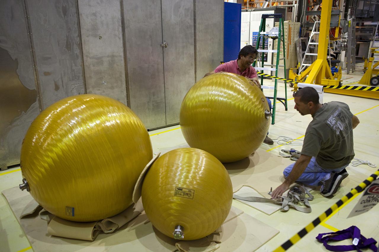 CAPE CANAVERAL, Fla. -- In Orbiter Processing Facility-2 at NASA’s Kennedy Space Center in Florida, United Space Alliance technicians secure several of space shuttle Endeavour’s main propulsion system tanks after they were removed from the orbiter’s mid-body. The tanks will be retained for possible future use on the agency’s Space Launch System Program. The work is part of Endeavour’s transition and retirement processing. The spacecraft is being prepared for public display at the California Science Center in Los Angeles. Endeavour flew 25 missions, spent 299 days in space, orbited Earth 4,671 times and traveled 122, 883, 151 miles over the course of its 19-year career. For more information, visit http://www.nasa.gov/shuttle. Photo credit: Dimitri Gerondidakis