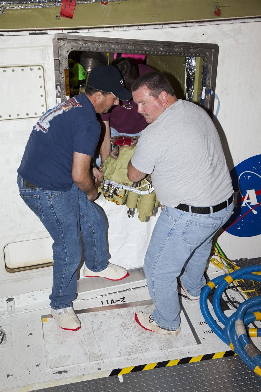 CAPE CANAVERAL, Fla. -- In Orbiter Processing Facility-2 at NASA’s Kennedy Space Center in Florida, United Space Alliance technicians remove one of the auxiliary power units from space shuttle Endeavour. The work is part of Endeavour’s transition and retirement processing. The spacecraft is being prepared for public display at the California Science Center in Los Angeles. Endeavour flew 25 missions, spent 299 days in space, orbited Earth 4,671 times and traveled 122, 883, 151 miles over the course of its 19-year career. For more information, visit http://www.nasa.gov/shuttle. Photo credit: NASA/Dimitri Gerondidakis