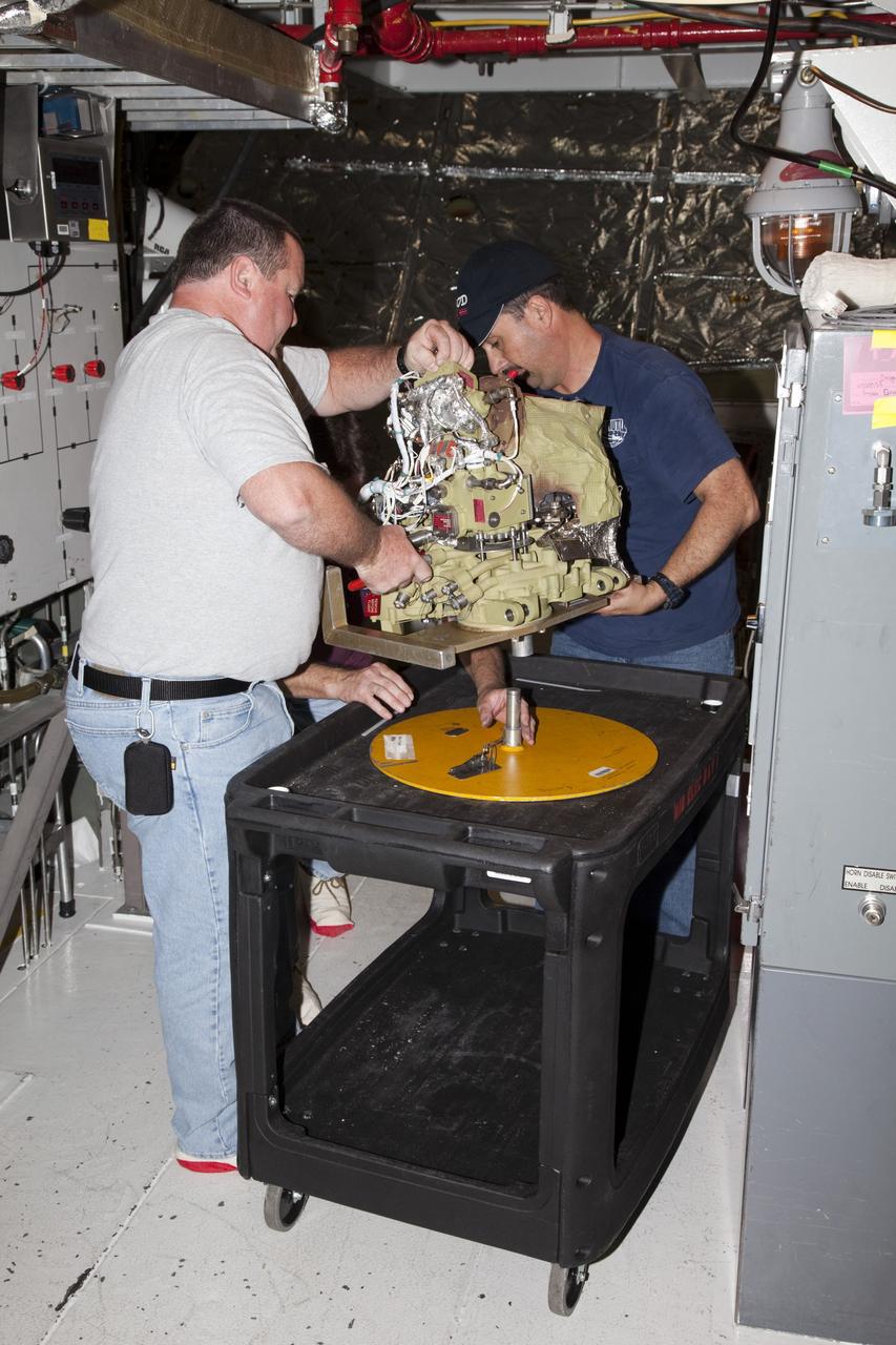 CAPE CANAVERAL, Fla. -- In Orbiter Processing Facility-2 at NASA’s Kennedy Space Center in Florida, United Space Alliance technicians have removed one of the auxiliary power units from space shuttle Endeavour and are placing it on a special cart. The work is part of Endeavour’s transition and retirement processing. The spacecraft is being prepared for public display at the California Science Center in Los Angeles. Endeavour flew 25 missions, spent 299 days in space, orbited Earth 4,671 times and traveled 122, 883, 151 miles over the course of its 19-year career. For more information, visit http://www.nasa.gov/shuttle. Photo credit: NASA/Dimitri Gerondidakis