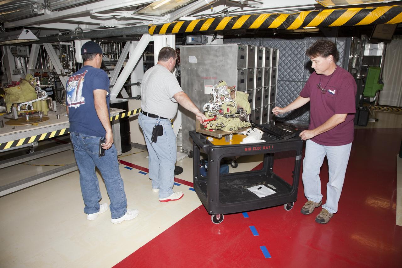 CAPE CANAVERAL, Fla. -- In Orbiter Processing Facility-2 at NASA’s Kennedy Space Center in Florida, United Space Alliance technicians have removed one of the auxiliary power units from space shuttle Endeavour and have transported it to an area inside OPF-2. The work is part of Endeavour’s transition and retirement processing. The spacecraft is being prepared for public display at the California Science Center in Los Angeles. Endeavour flew 25 missions, spent 299 days in space, orbited Earth 4,671 times and traveled 122, 883, 151 miles over the course of its 19-year career. For more information, visit http://www.nasa.gov/shuttle. Photo credit: NASA/Dimitri Gerondidakis