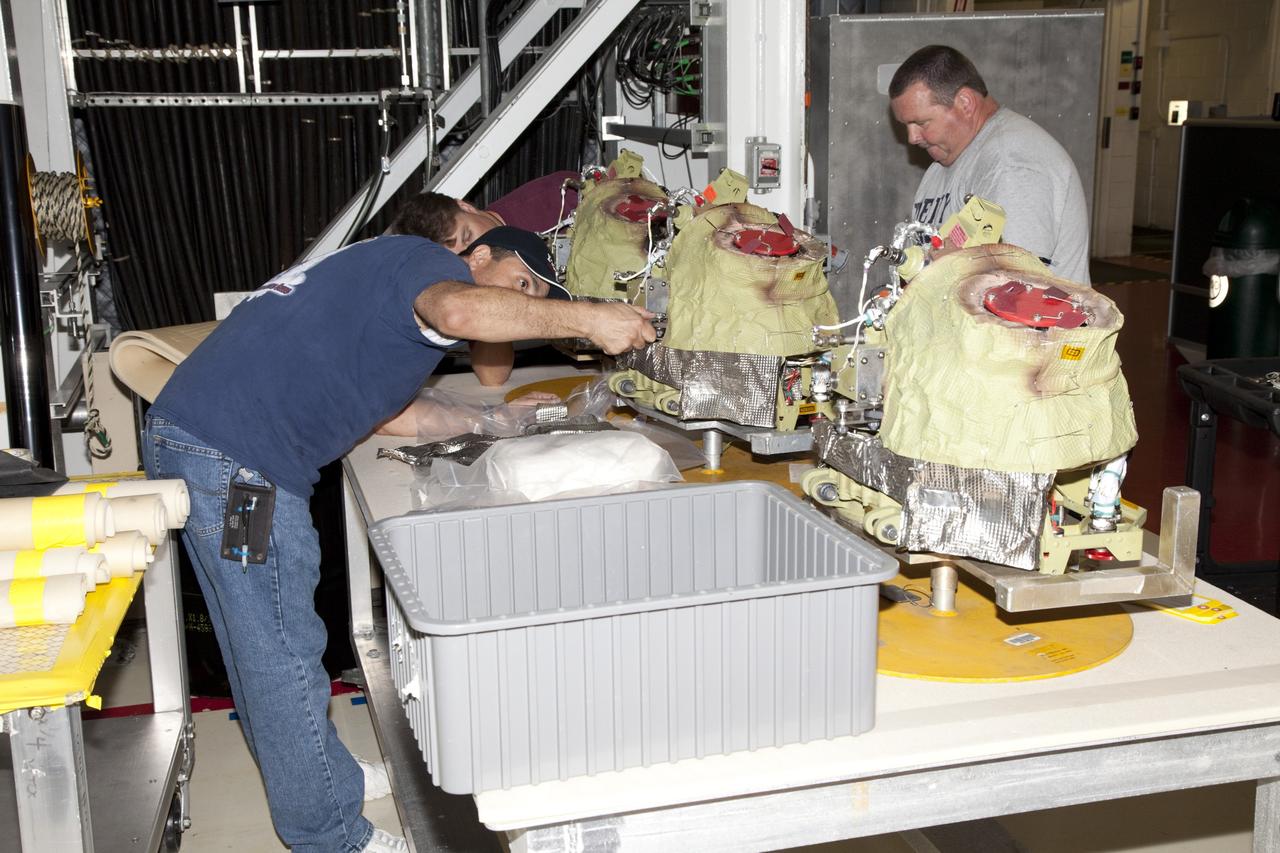 CAPE CANAVERAL, Fla. -- In Orbiter Processing Facility-2 at NASA’s Kennedy Space Center in Florida, United Space Alliance technicians have removed several auxiliary power units from space shuttle Endeavour and are preparing them for transport. The work is part of Endeavour’s transition and retirement processing. The spacecraft is being prepared for public display at the California Science Center in Los Angeles. Endeavour flew 25 missions, spent 299 days in space, orbited Earth 4,671 times and traveled 122, 883, 151 miles over the course of its 19-year career. For more information, visit http://www.nasa.gov/shuttle. Photo credit: NASA/Dimitri Gerondidakis