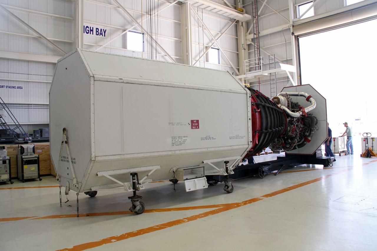 CAPE CANAVERAL, Fla. -- A Pratt and Whitney Rocketdyne space shuttle main engine, or SSME, is aligned with a transportation canister in the Orbiter Processing Facility-3 engine shop at NASA's Kennedy Space Center in Florida. The engine is the last to be packed for shipment to NASA's Stennis Space Center in Mississippi. The first two groups of engines were shipped from Kennedy to Stennis in November 2011 and January 2012, and the remaining engines are scheduled to depart on April 9. Altogether, 15 shuttle-era engines will be stored at Stennis for reuse on NASA’s Space Launch System heavy-lift rocket, under development. Photo credit: NASA/Cory Huston