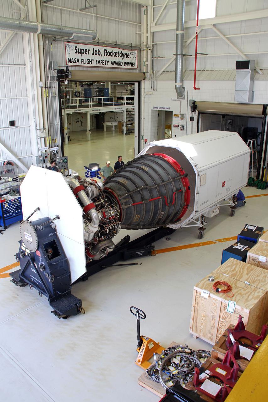 CAPE CANAVERAL, Fla. -- In the Orbiter Processing Facility-3 engine shop at NASA's Kennedy Space Center in Florida, a Pratt and Whitney Rocketdyne space shuttle main engine, or SSME, is prepared for loading into a waiting transportation canister for shipment to NASA's Stennis Space Center in Mississippi. The first two groups of engines were shipped from Kennedy to Stennis in November 2011 and January 2012, and the remaining engines are scheduled to depart on April 9. Altogether, 15 shuttle-era engines will be stored at Stennis for reuse on NASA’s Space Launch System heavy-lift rocket, under development. Photo credit: NASA/Cory Huston