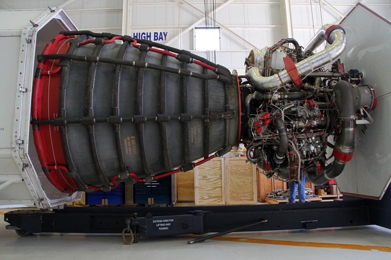 CAPE CANAVERAL, Fla. -- A Pratt and Whitney Rocketdyne space shuttle main engine, or SSME, begins to move into a transportation canister in the Orbiter Processing Facility-3 engine shop at NASA's Kennedy Space Center in Florida. The engine is the last to be packed for shipment to NASA's Stennis Space Center in Mississippi. The first two groups of engines were shipped from Kennedy to Stennis in November 2011 and January 2012, and the remaining engines are scheduled to depart on April 9. Altogether, 15 shuttle-era engines will be stored at Stennis for reuse on NASA’s Space Launch System heavy-lift rocket, under development. Photo credit: NASA/Cory Huston