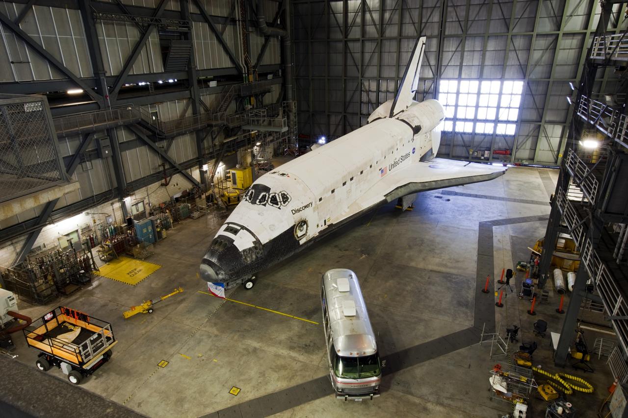 CAPE CANAVERAL, Fla. – Inside the Vehicle Assembly Building, or VAB, at NASA’s Kennedy Space Center in Florida, an overhead view shows space shuttle Discovery in high bay 4 with the Astrovan alongside. The Astrovan was used to transport astronauts to Launch Complex 39 for space shuttle missions. The Astrovan is being displayed for Kennedy Space Center Visitor Complex guests who take the VAB tour. During the Space Shuttle Program’s transition and retirement processing, Discovery was prepared for display at Smithsonian’s National Air and Space Museum, Steven F. Udvar-Hazy Center in Chantilly, Va. Discovery is scheduled to be transported atop a NASA Shuttle Carrier Aircraft modified 747 jet to Dulles International Airport in Virginia on April 17 and then moved to the Smithsonian for permanent public display on April 19. For more information, visit http://www.nasa.gov/shuttle. Photo credit: NASA/Jim Grossmann