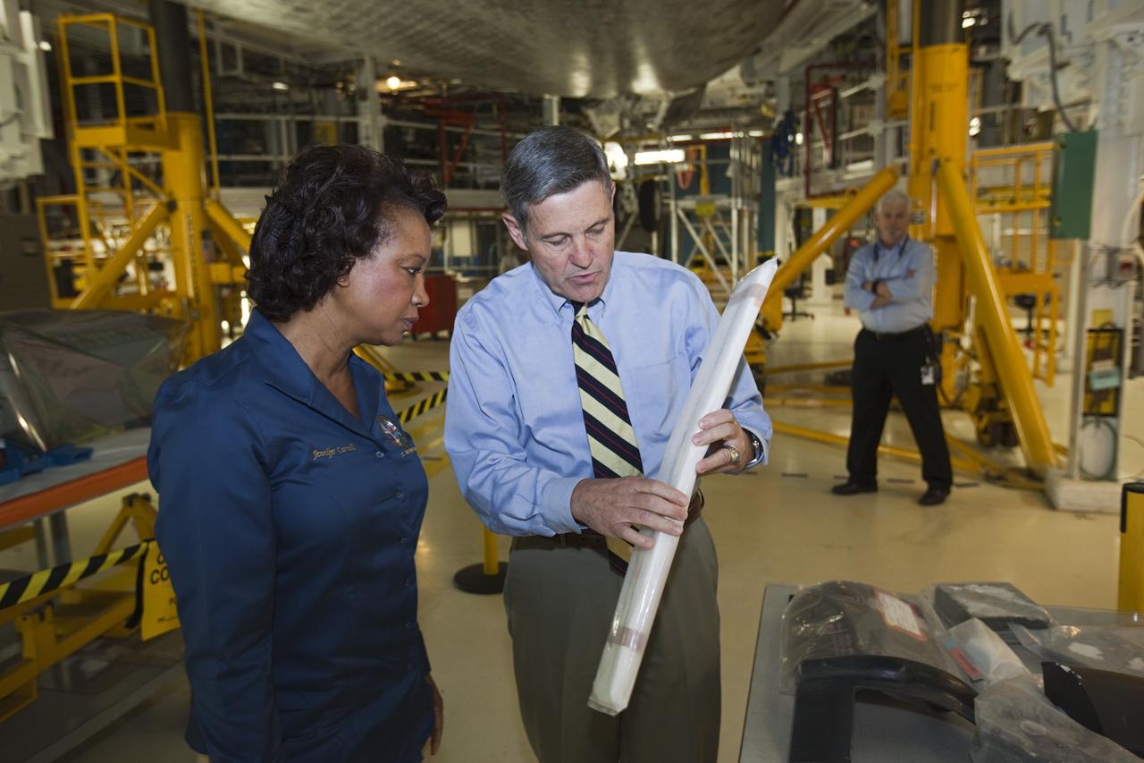 CAPE CANAVERAL, Fla. – Kennedy Space Center Director Bob Cabana, right, shows a space shuttle felt reusable surface insulation FRSI blanket to Florida’s Lt. Gov. Jennifer Carroll during a tour of Kennedy’s Orbiter Processing Facility-1. The blanket is part of the shuttle’s thermal protection system which covers the shuttle’s exterior and protects it from the heat of re-entry. The tour coincided with Carroll’s visit to Kennedy for a meeting with Cabana. Atlantis is being prepared for public display at the Kennedy Space Center Visitor Complex in 2013. The groundbreaking for Atlantis’ exhibit hall took place in January Atlantis is scheduled to be moved to the visitor complex in November. For more information, visit http://www.nasa.gov/shuttle. Photo credit: NASA/Jim Grossmann