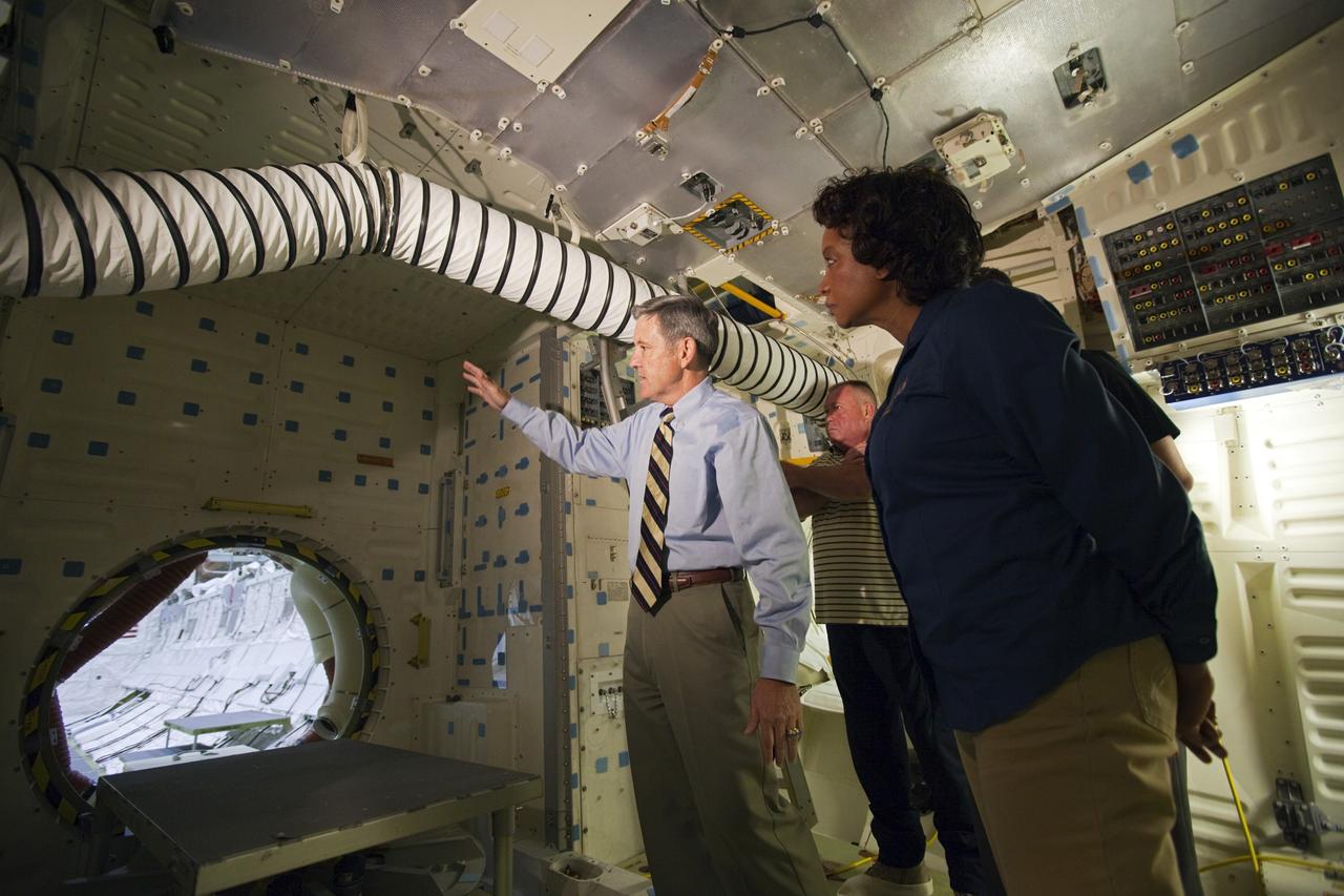 CAPE CANAVERAL, Fla. – Kennedy Space Center Director Bob Cabana, left, a former astronaut, explains how access is gained to a shuttle’s midbody, or payload bay, to Florida’s Lt. Gov. Jennifer Carroll from the middeck of space shuttle Atlantis during a tour of Kennedy’s Orbiter Processing Facility-1. The tour coincided with Carroll’s visit to Kennedy for a meeting with Cabana. Atlantis is being prepared for public display at the Kennedy Space Center Visitor Complex in 2013. The groundbreaking for Atlantis’ exhibit hall took place in January Atlantis is scheduled to be moved to the visitor complex in November. For more information, visit http://www.nasa.gov/shuttle. Photo credit: NASA/Jim Grossmann