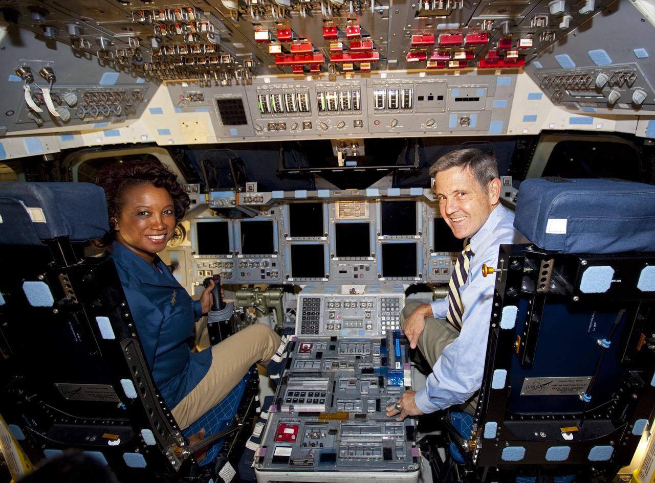 CAPE CANAVERAL, Fla. – Florida’s Lt. Gov. Jennifer Carroll, left, gets the feel of the commander’s seat on the flight deck of space shuttle Atlantis during a tour of Kennedy Space Center’s Orbiter Processing Facility-1. Kennedy Director Bob Cabana, a former astronaut, is right at home in the pilot’s seat beside her. The tour coincided with Carroll’s visit to Kennedy for a meeting with Cabana. Atlantis is being prepared for public display at the Kennedy Space Center Visitor Complex in 2013. The groundbreaking for Atlantis’ exhibit hall took place in January Atlantis is scheduled to be moved to the visitor complex in November. For more information, visit http://www.nasa.gov/shuttle. Photo credit: NASA/Jim Grossmann
