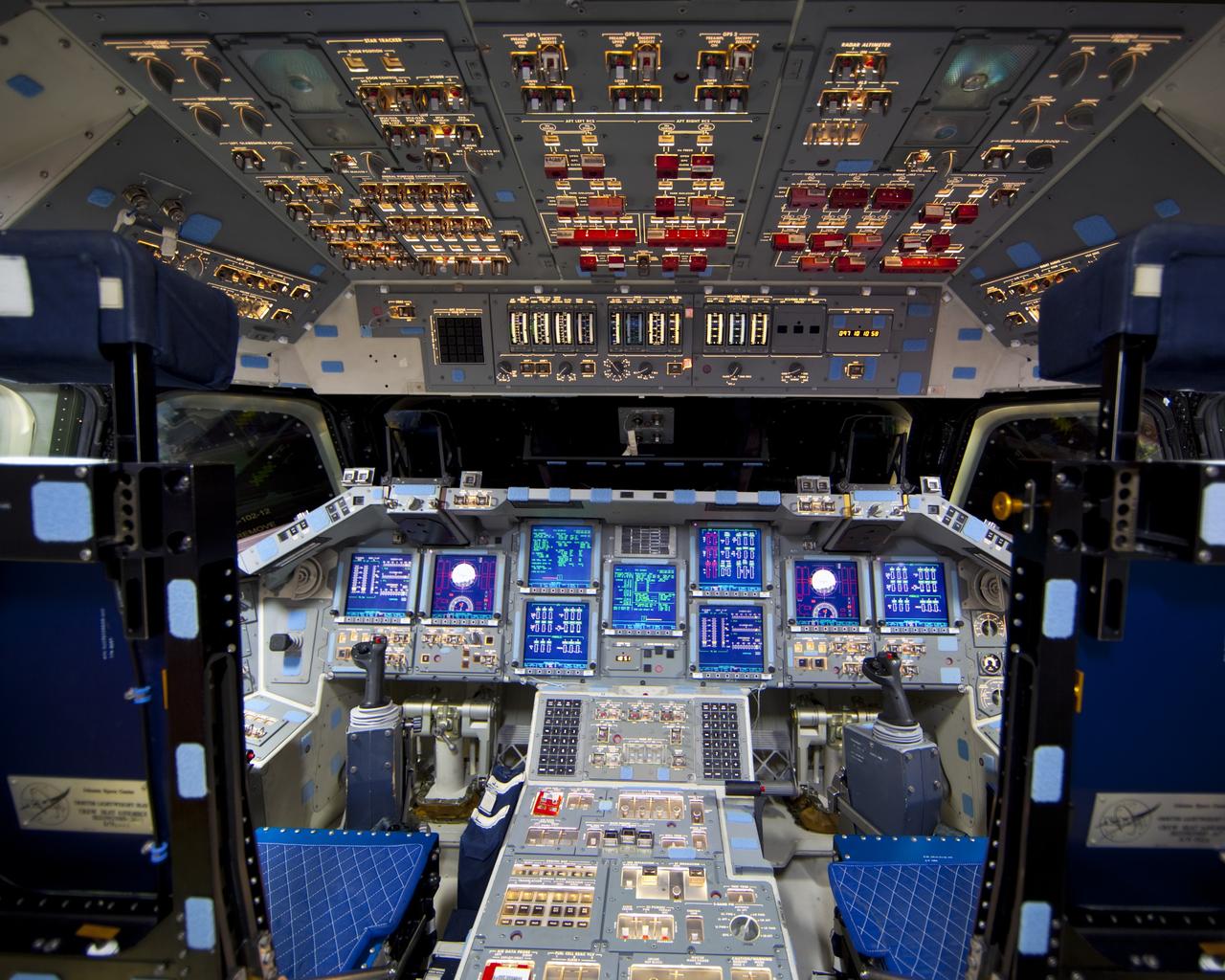 CAPE CANAVERAL, Fla. – In Orbiter Processing Facility-2 at NASA's Kennedy Space Center in Florida, the flight deck of space shuttle Endeavour is illuminated during Space Shuttle Program transition and retirement activities. Endeavour is being prepared for public display at the California Science Center in Los Angeles. Over the course of its 19-year career, Endeavour spent 299 days in space during 25 missions. For more information, visit http://www.nasa.gov/shuttle. Photo credit: NASA/Dimitri Gerondidakis