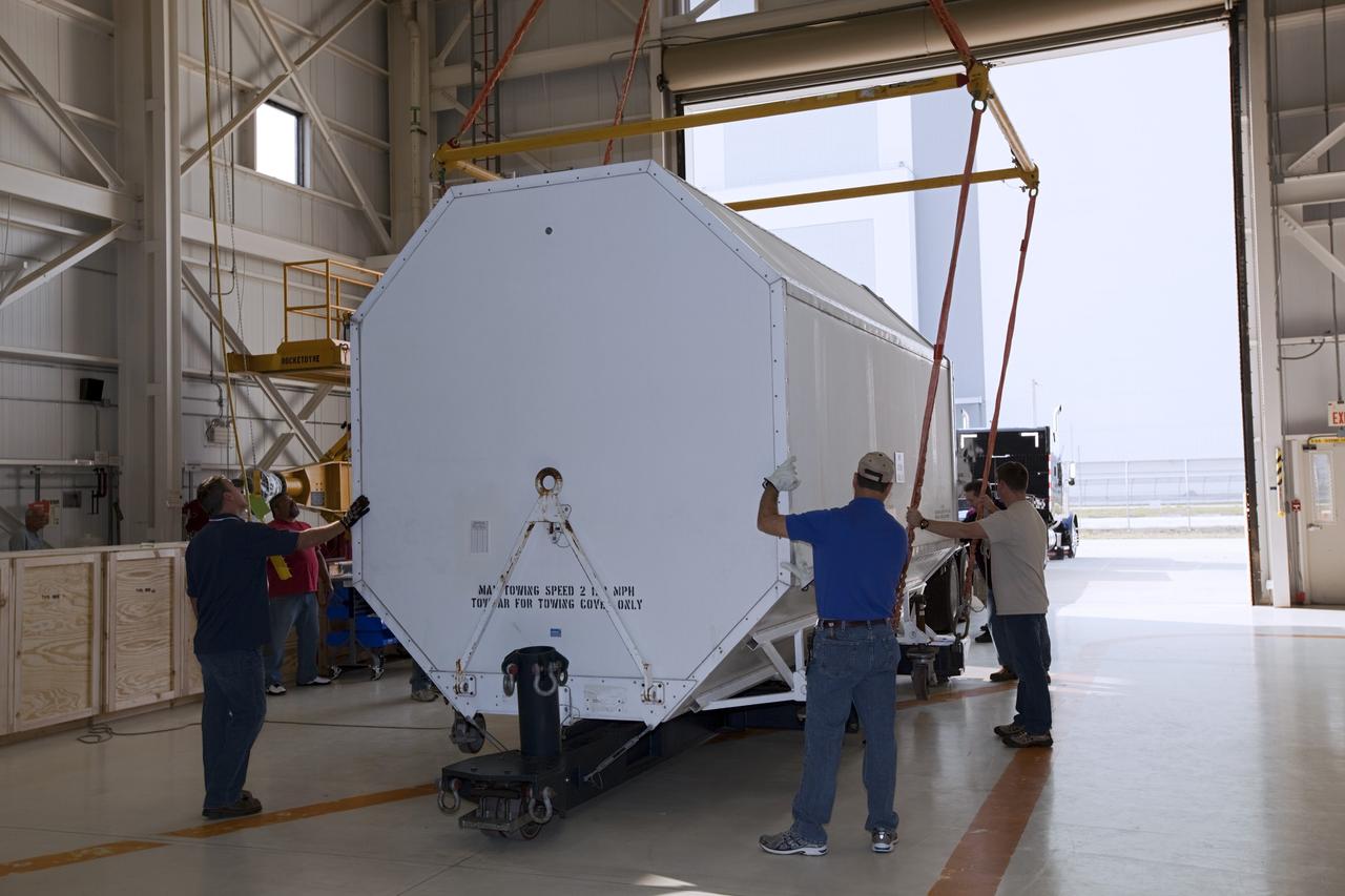 CAPE CANAVERAL, Fla. – In the Orbiter Processing Facility-3 engine shop at NASA's Kennedy Space Center in Florida, preparations are under way to load the transportation canister containing the last Pratt and Whitney Rocketdyne space shuttle main engine, or SSME, onto a flatbed truck for shipment to NASA's Stennis Space Center in Mississippi. The first two groups of engines were shipped from Kennedy to Stennis in November 2011 and January 2012 the remaining engines departed today. Altogether, 15 shuttle-era engines will be stored at Stennis for reuse on NASA’s Space Launch System heavy-lift rocket, under development. Photo credit: NASA/Dimitri Gerondidakis